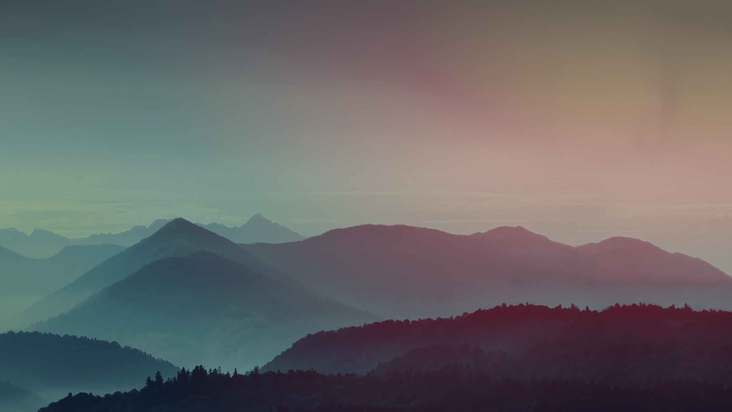 Misty mountains at sunrise with colorful sky HD Wallpaper