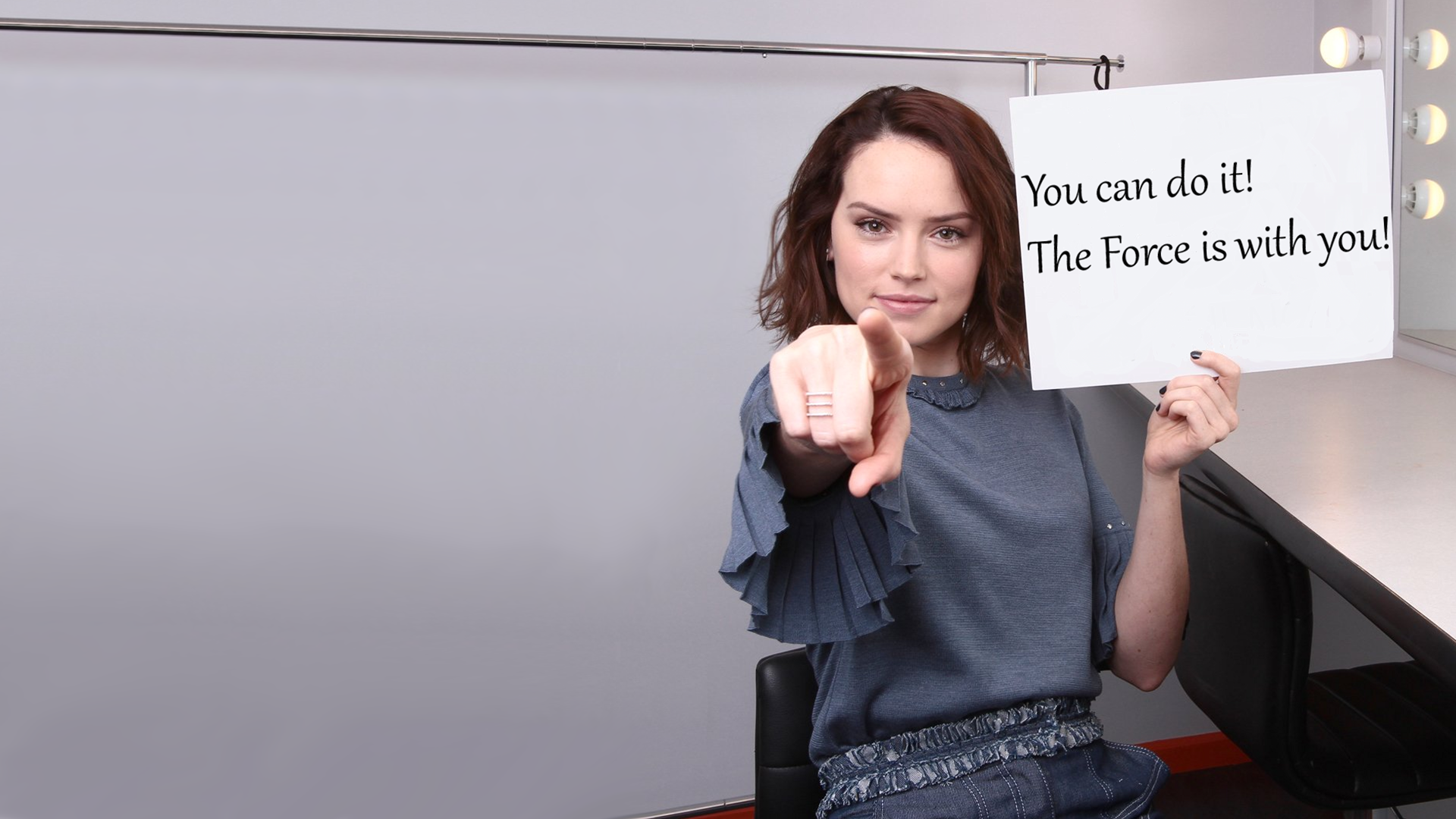 Daisy Ridley from Star Wars holding a sign HD Wallpaper