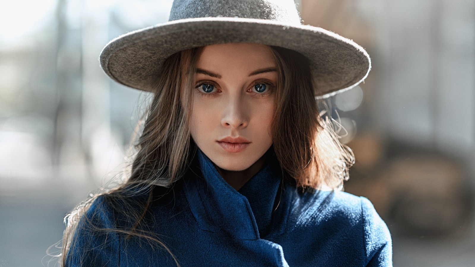 Woman wearing a hat and blue coat HD Wallpaper