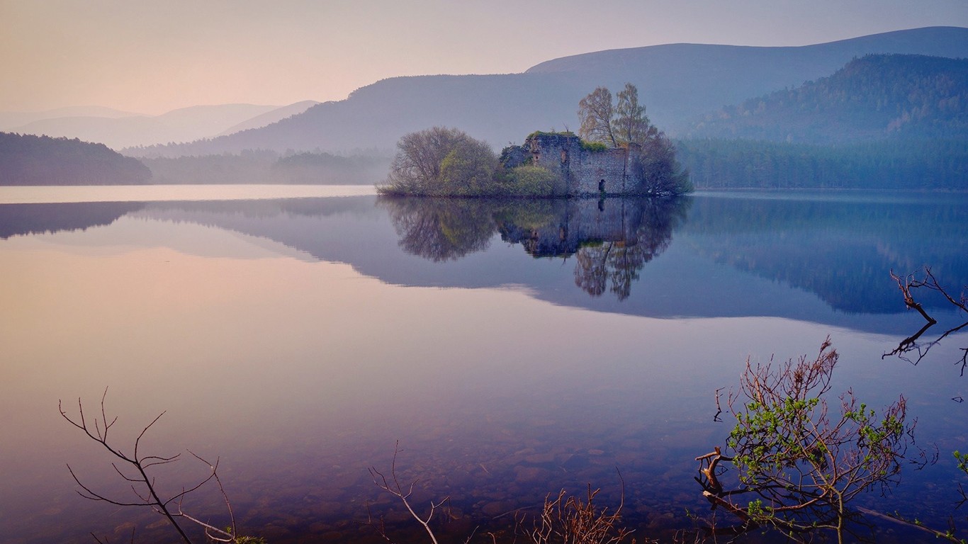 Ruined castle on an island in a misty lake HD Wallpaper