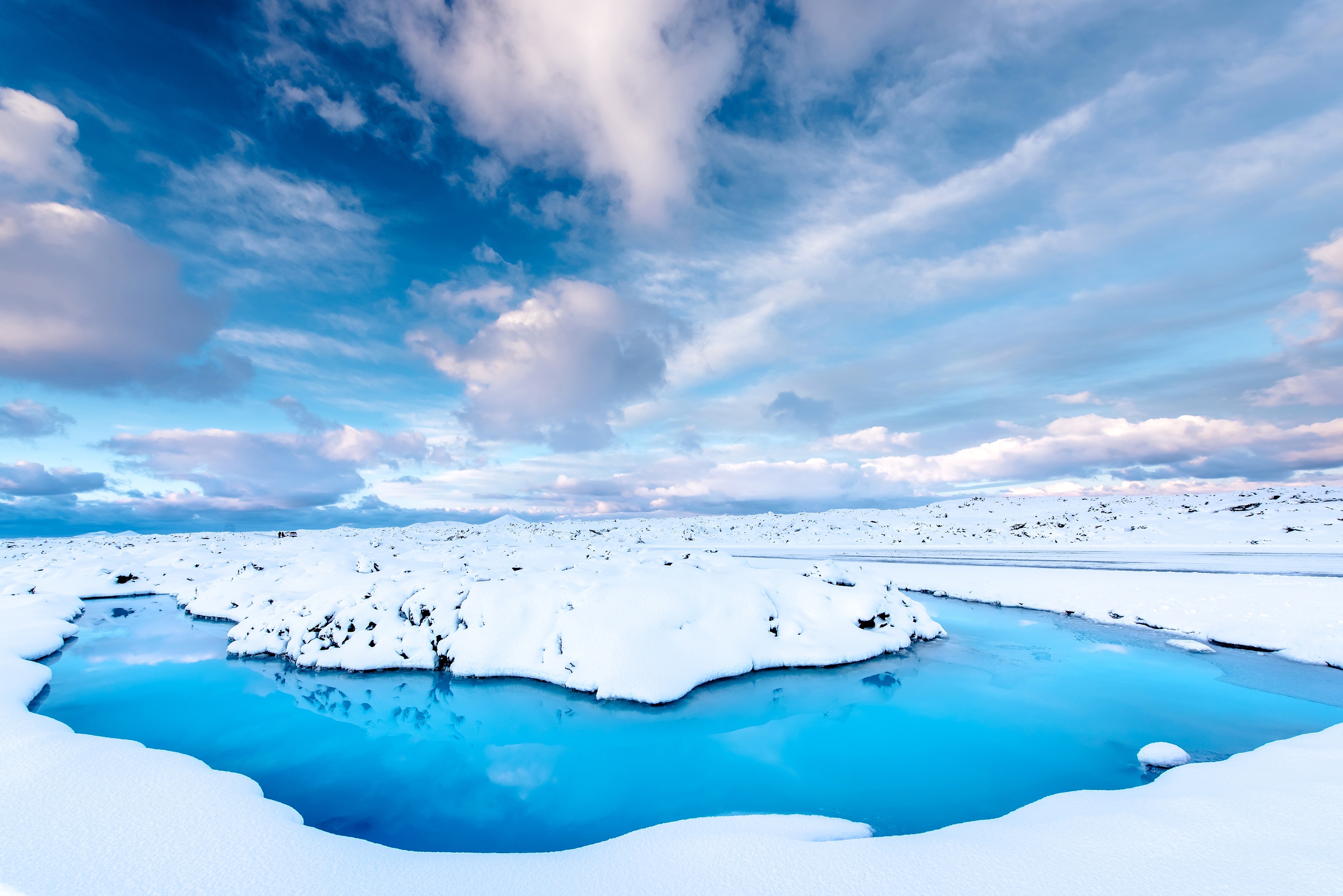 Blue Lagoon in Iceland during winter with snow and clouds HD Wallpaper