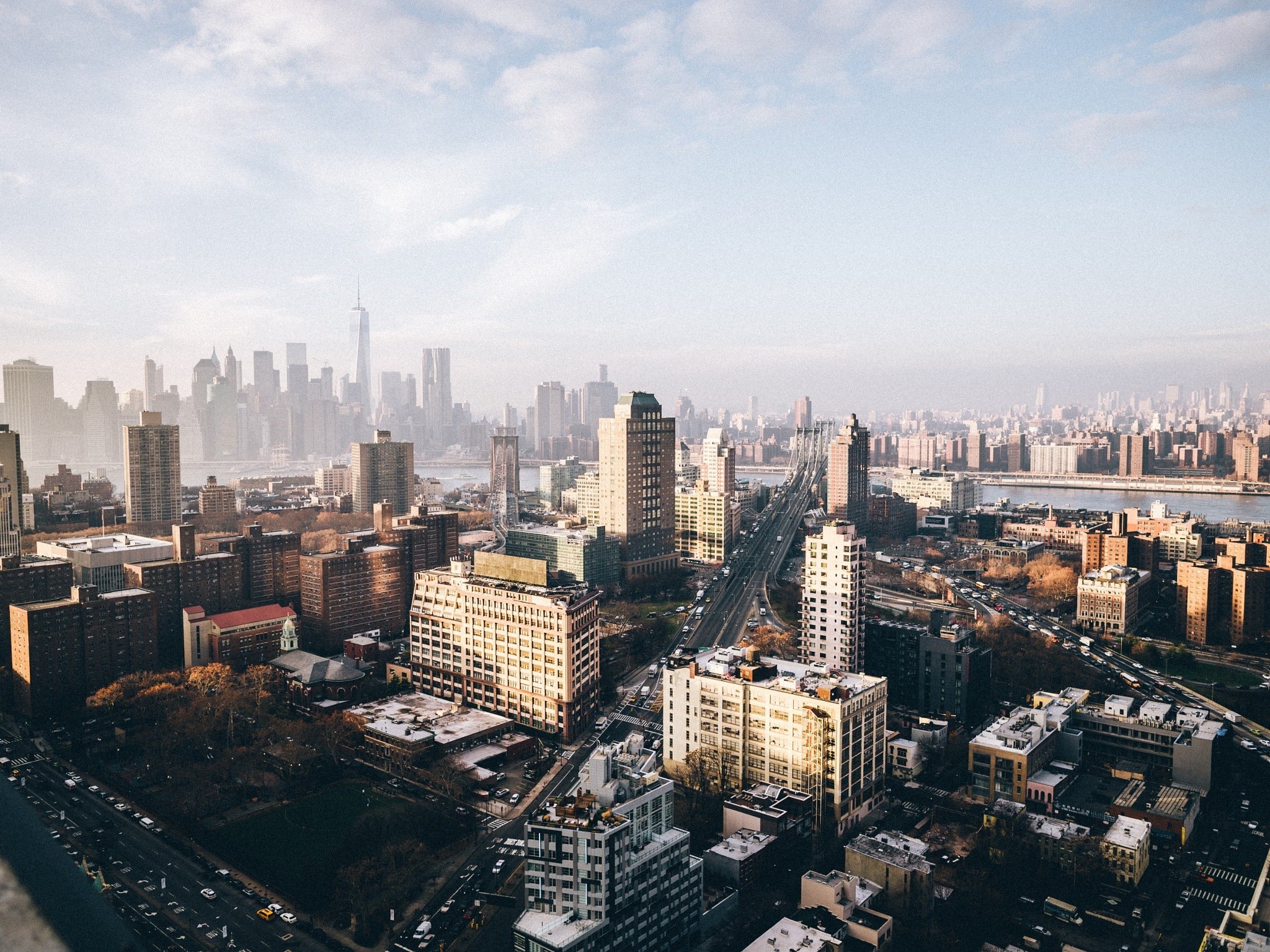 New York City cityscape with skyscrapers and bridge HD Wallpaper