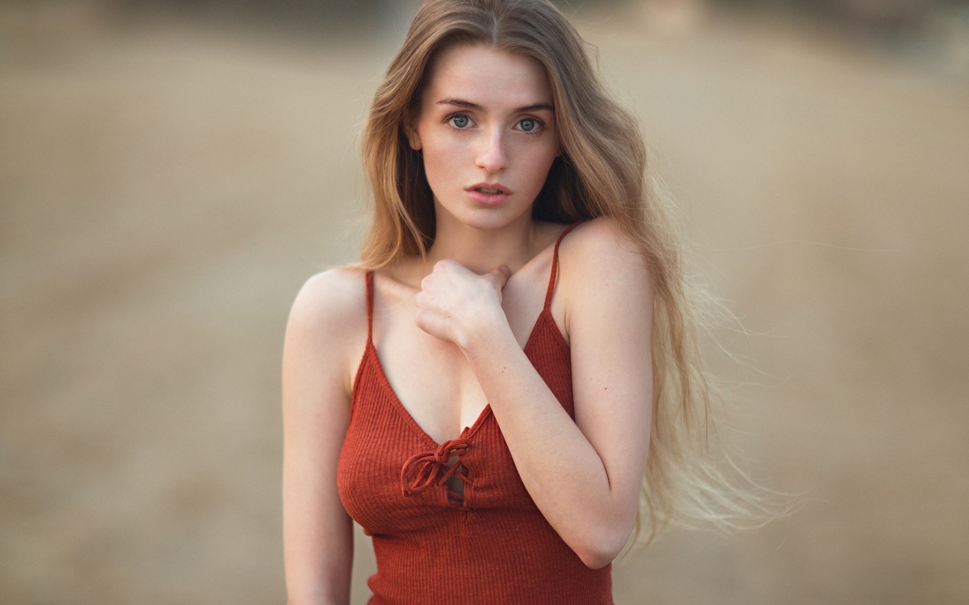 Woman with long blonde hair wearing a red top HD Wallpaper