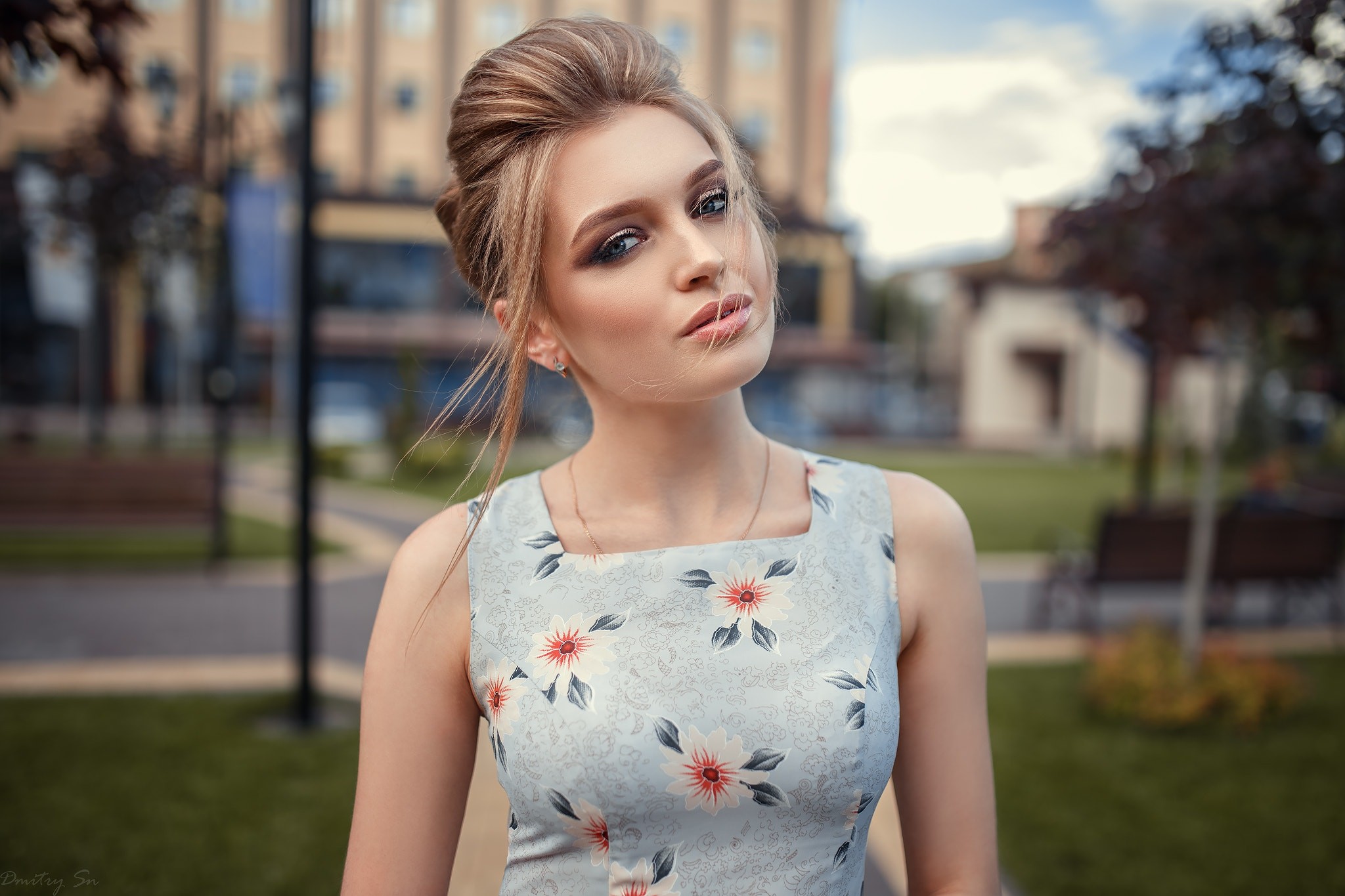 Woman with blonde hair in a floral dress outdoors HD Wallpaper