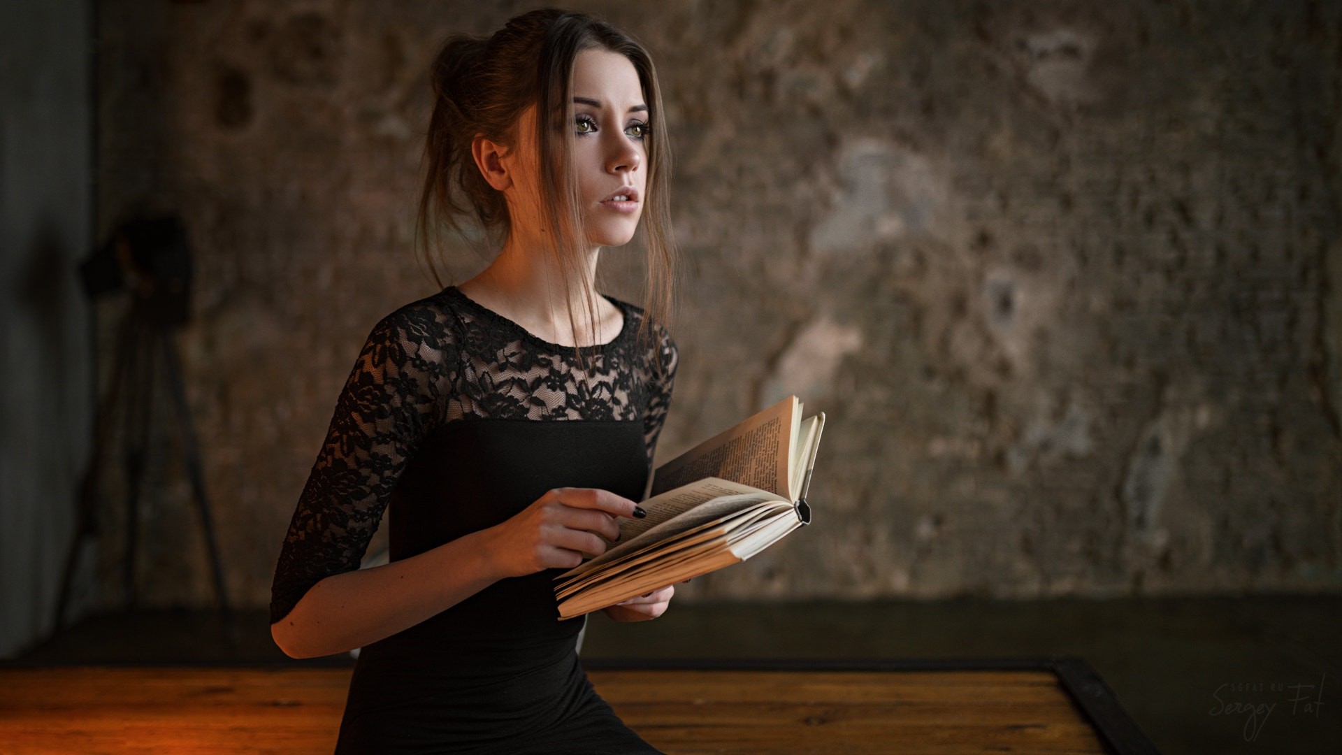Ksenia Kokoreva in black dress holding a book HD Wallpaper