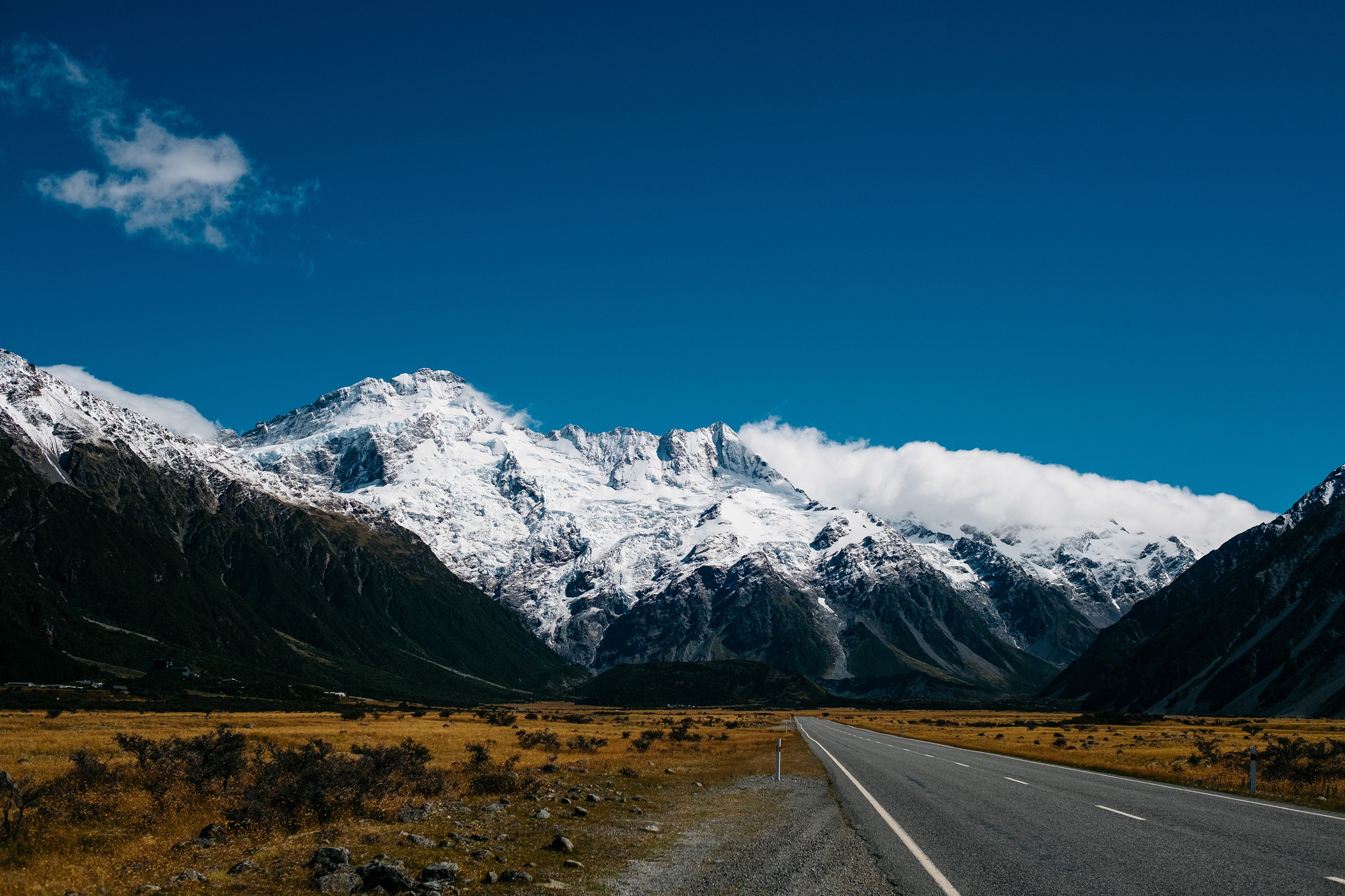 Snow-capped mountains and a road in New Zealand HD Wallpaper