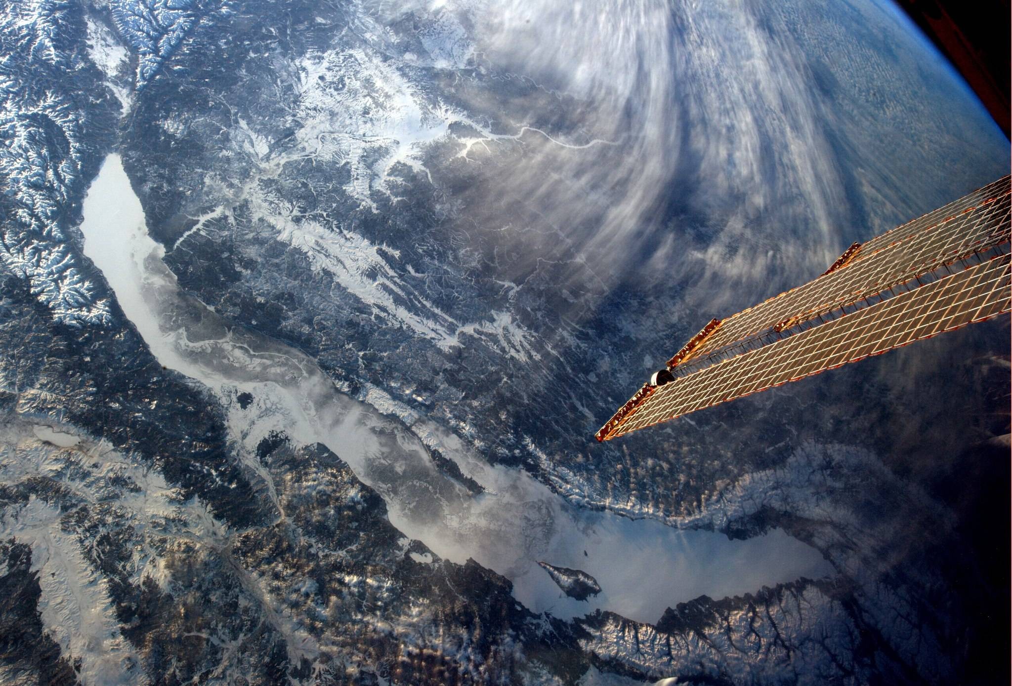 Orbital view of Lake Baikal, Russia, covered in snow HD Wallpaper
