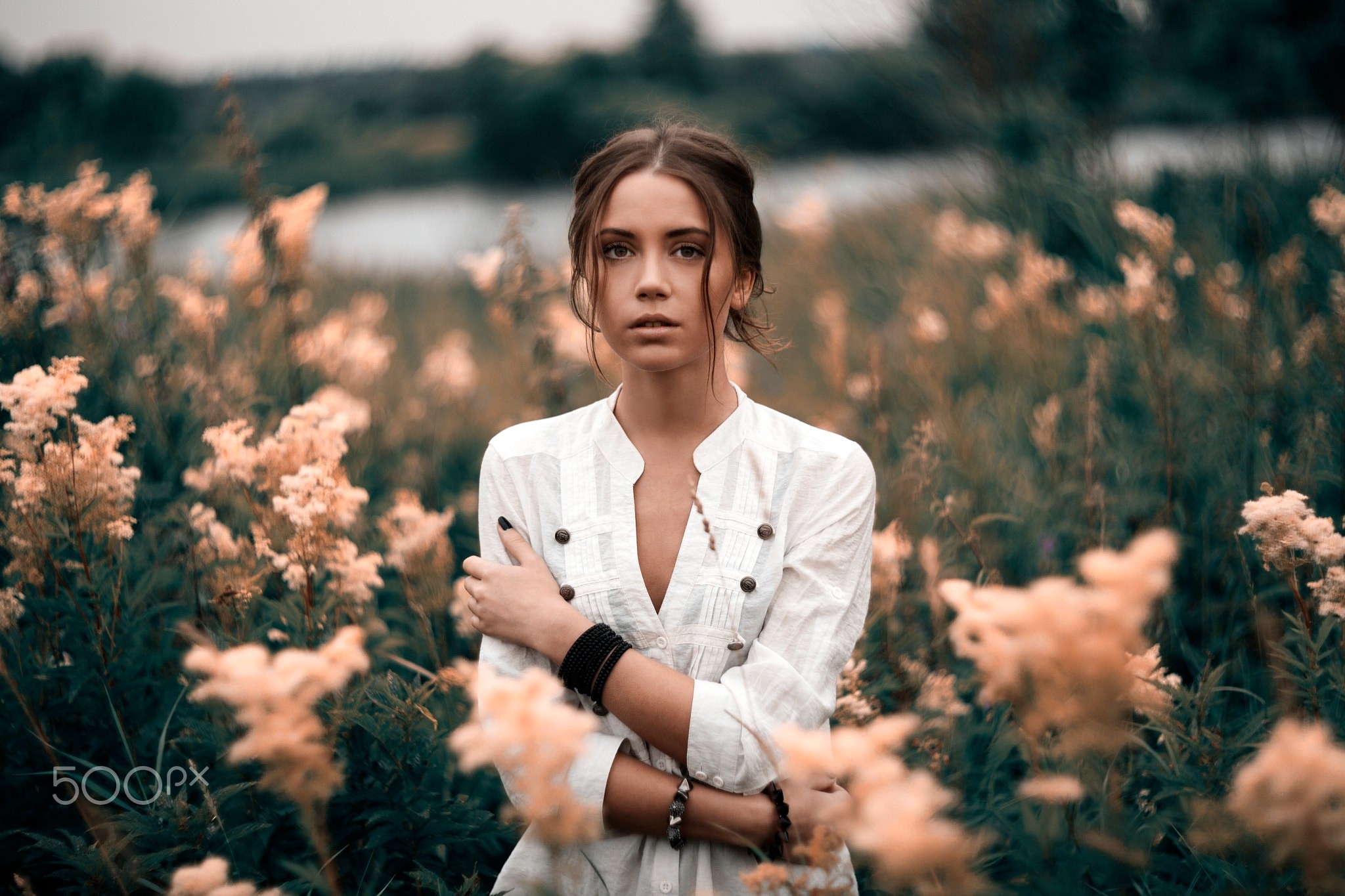 Woman in white shirt standing in a field HD Wallpaper