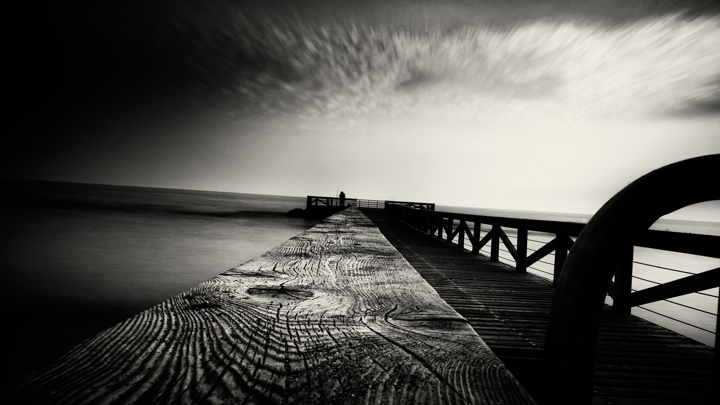 Black and White Pier Overlooking the Ocean HD Wallpaper