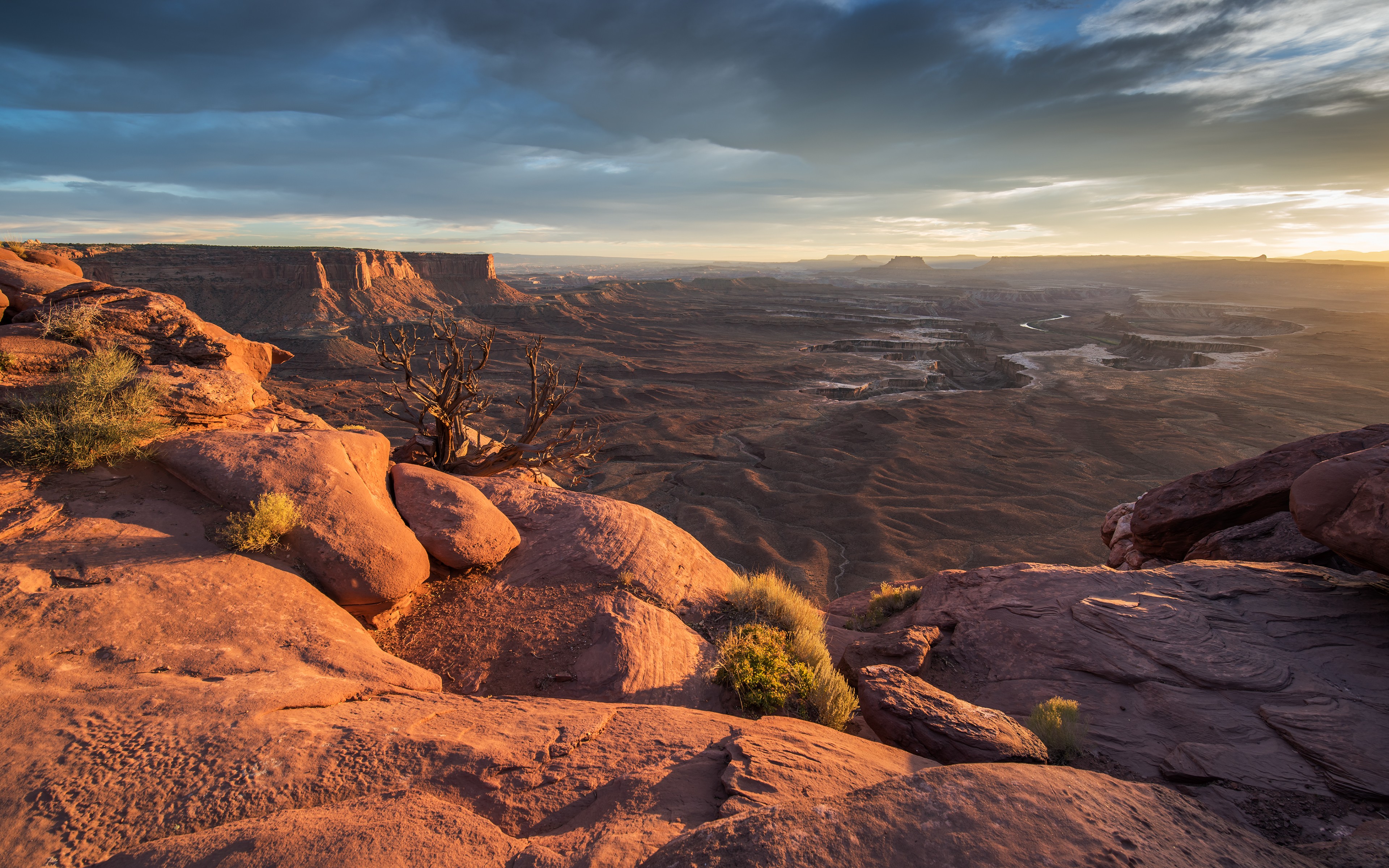 Sunrise over a vast canyon landscape HD Wallpaper