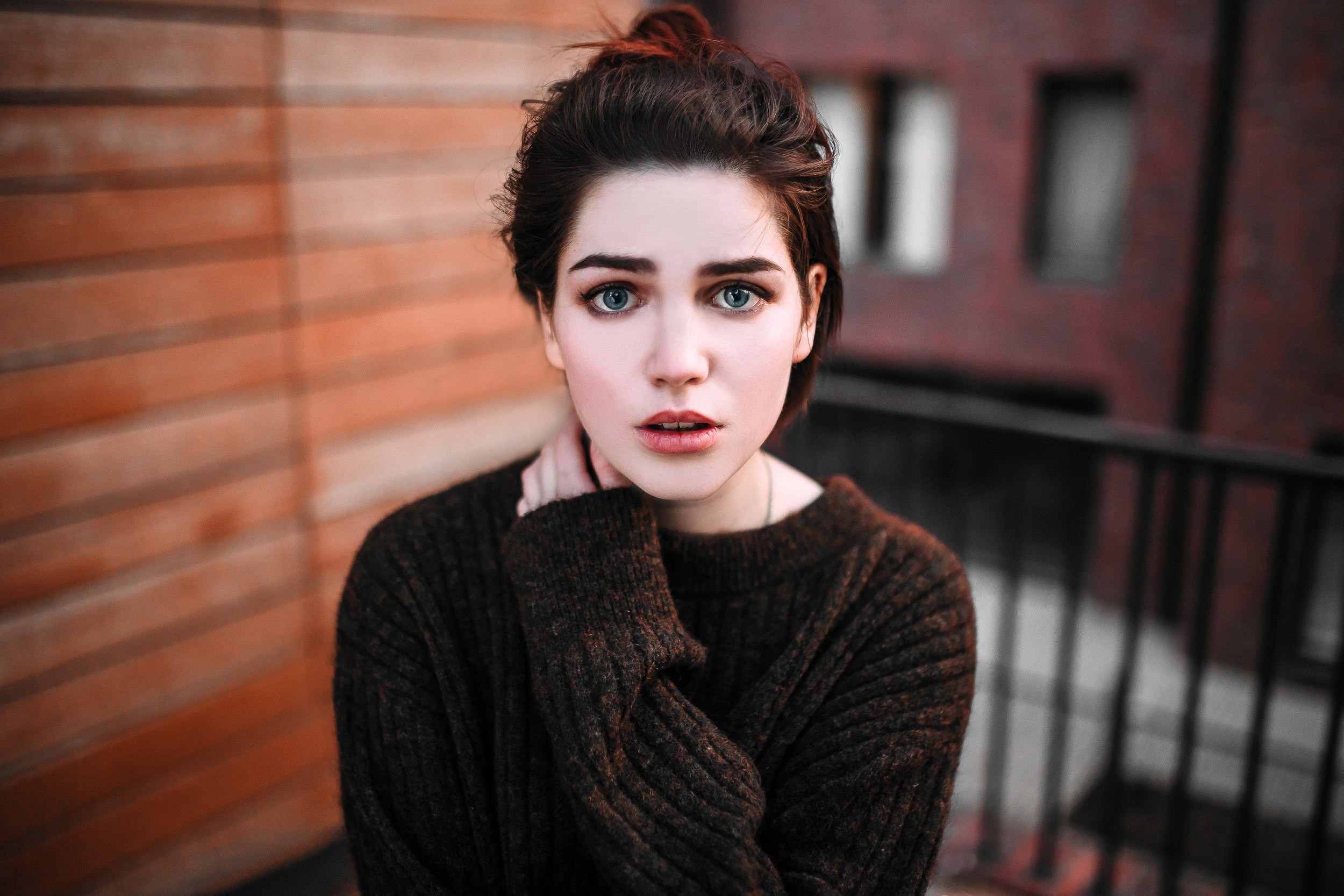 Woman with blue eyes wearing a sweater HD Wallpaper