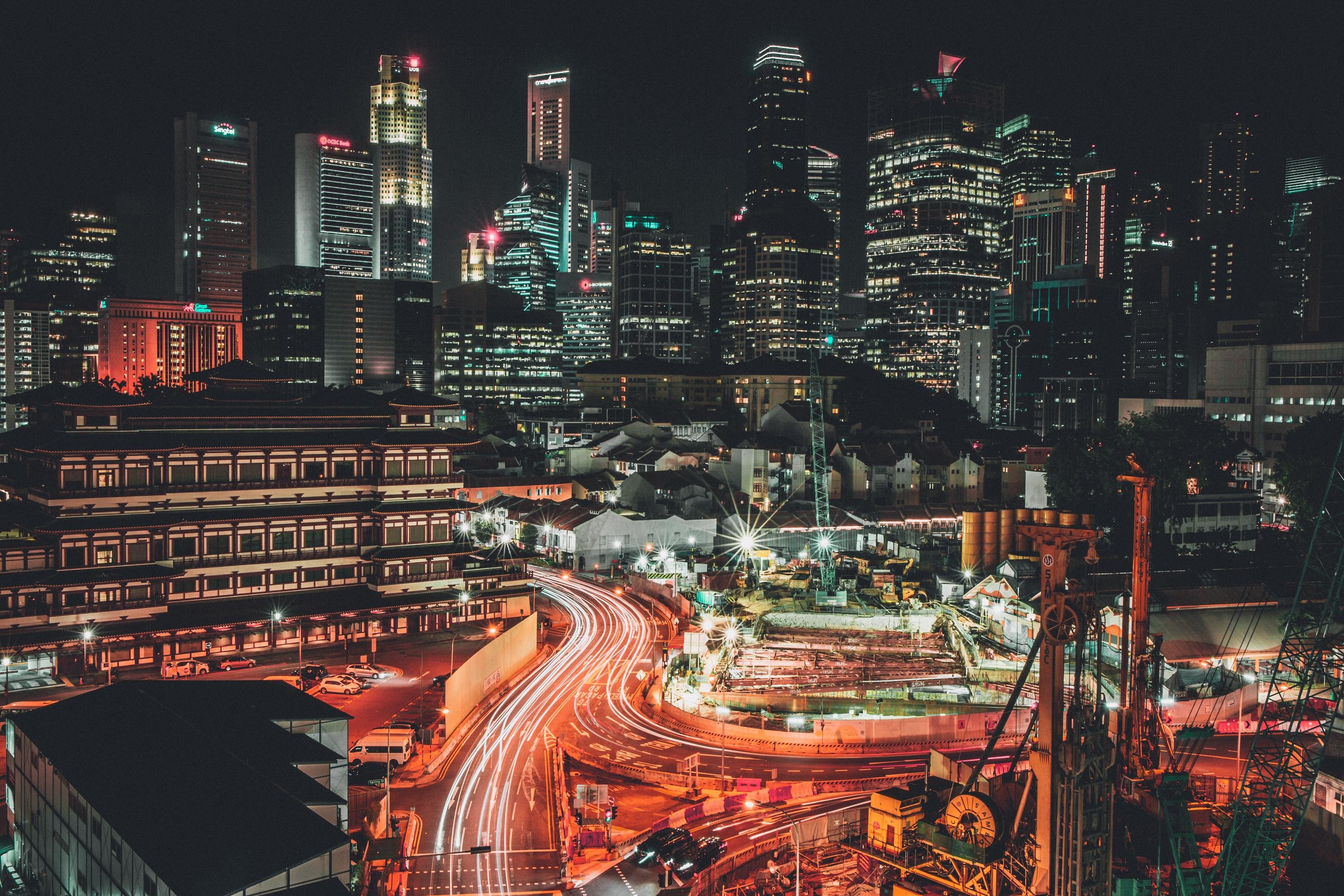 Night cityscape with skyscrapers and light trails HD Wallpaper