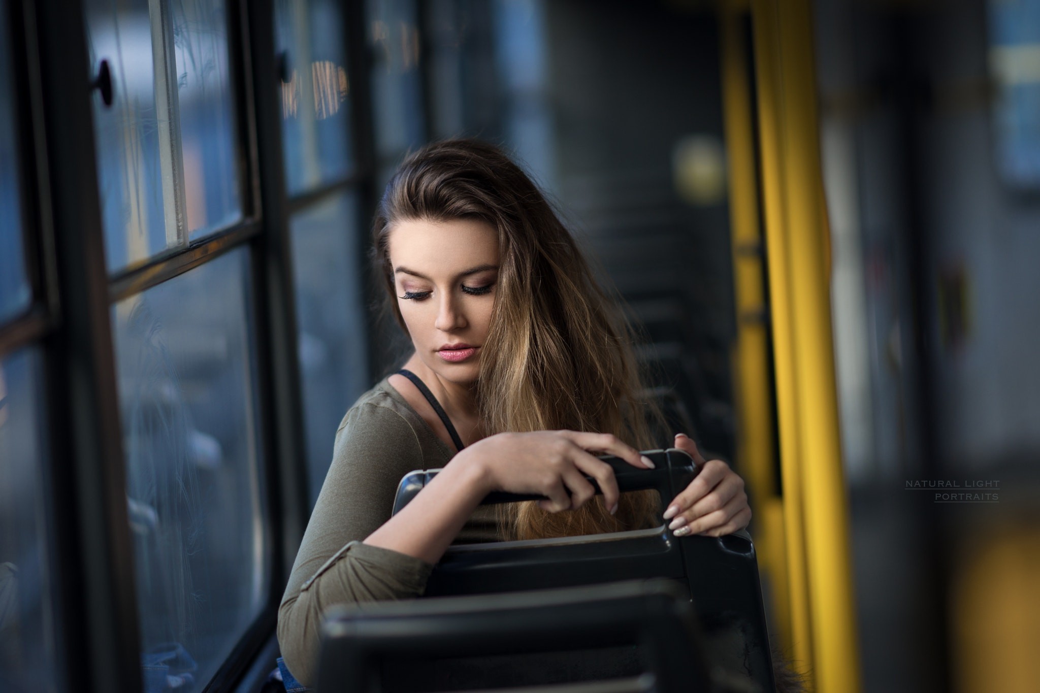 Woman with blonde hair sitting by a window HD Wallpaper