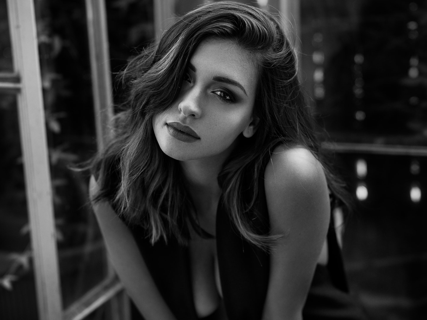 Woman with dark hair and smoky eyes looking at viewer HD Wallpaper