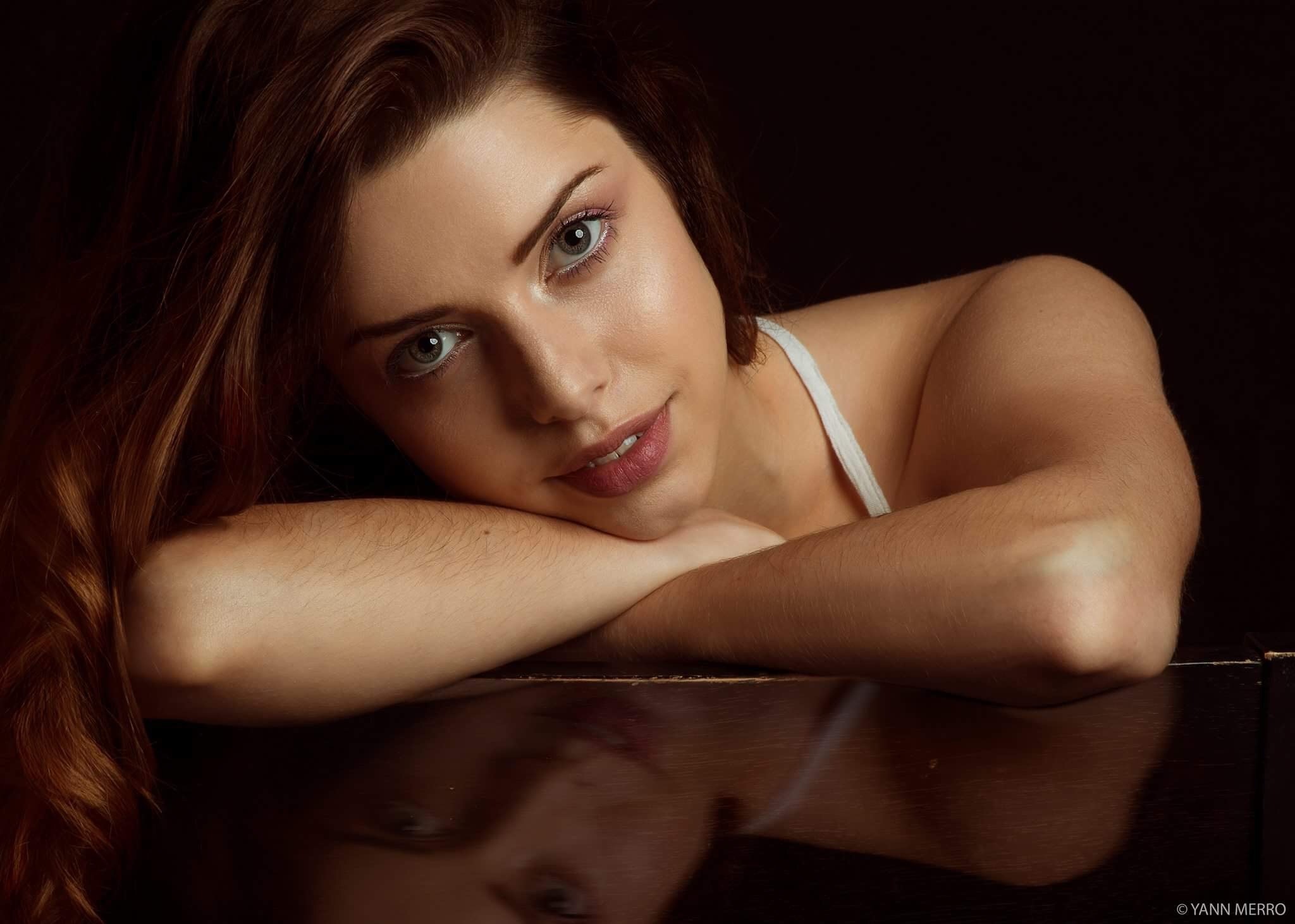 Woman with long brown hair resting her arms HD Wallpaper