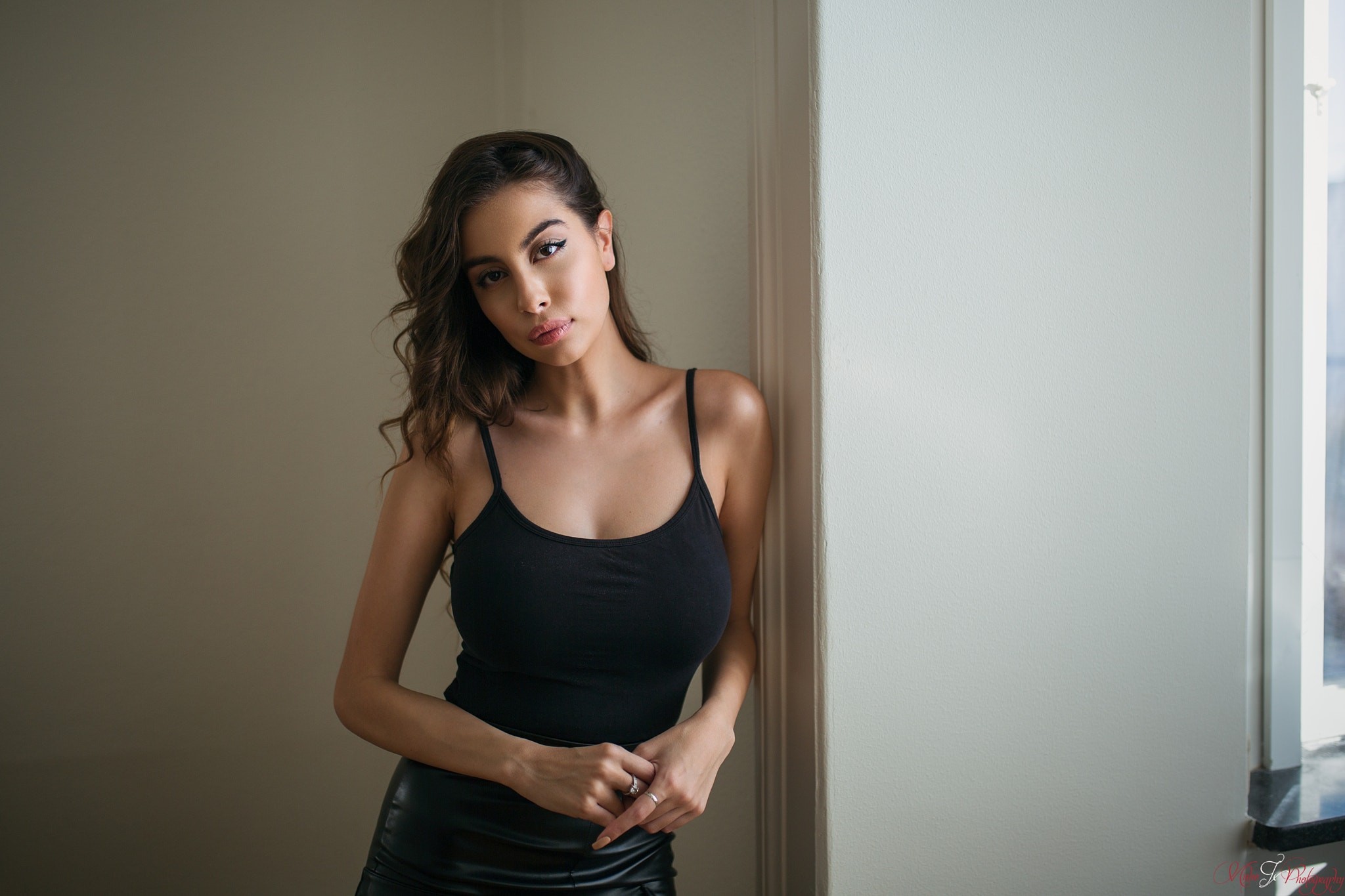 Woman in black tank top and leather skirt HD Wallpaper