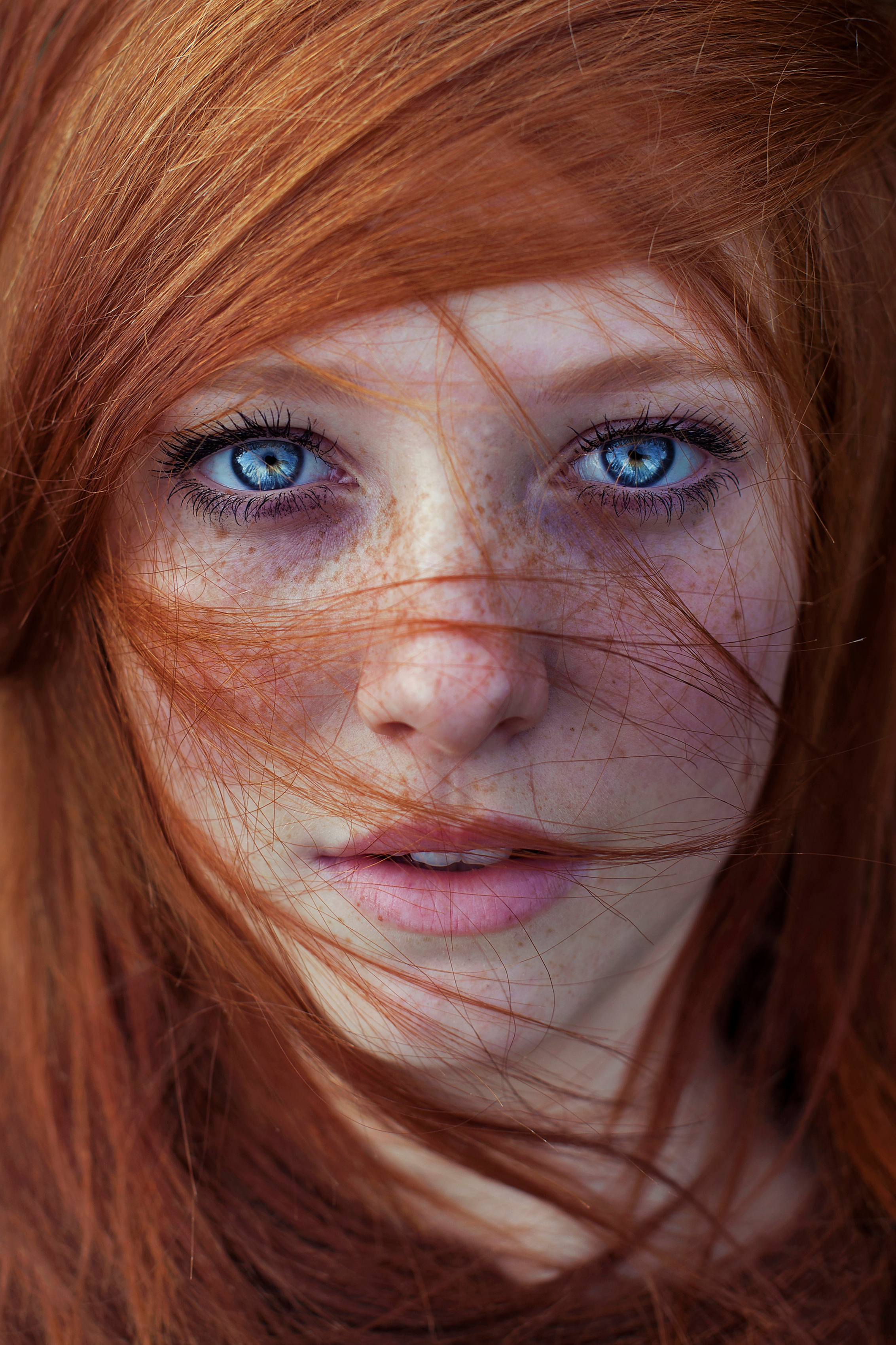 Portrait of a redhead woman with blue eyes and freckles HD Wallpaper