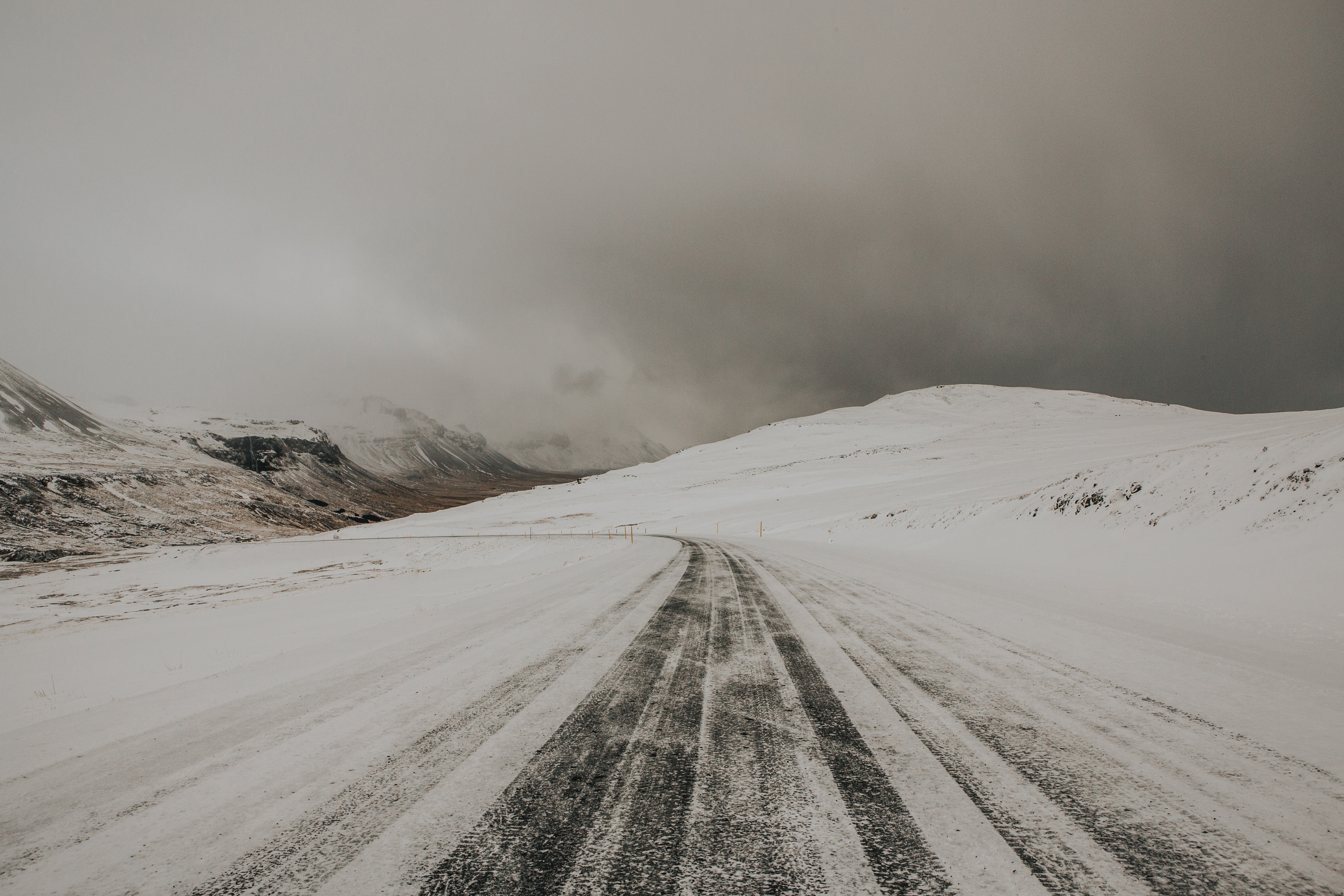 Snowy mountain road in winter HD Wallpaper