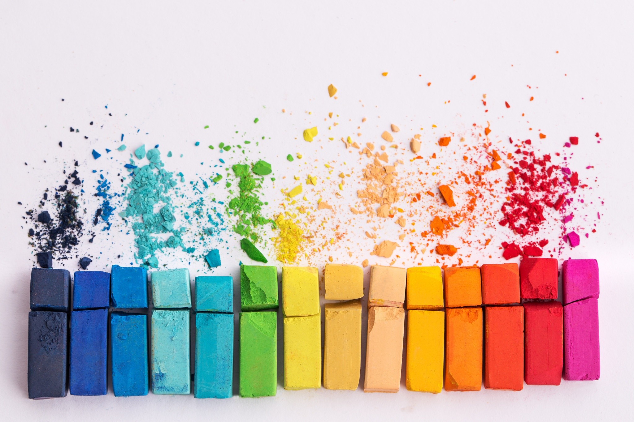 Colorful chalk pastels arranged in a rainbow gradient HD Wallpaper