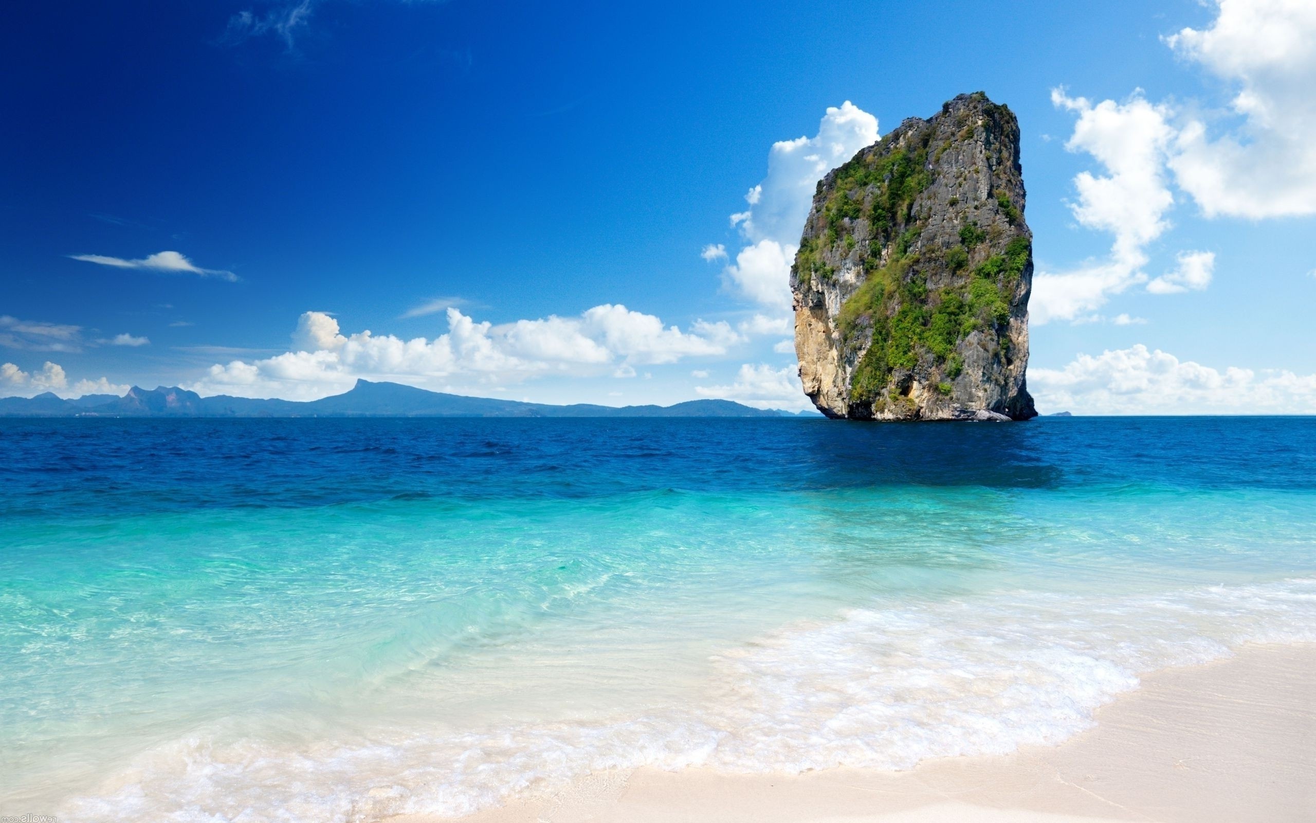 Tropical island rock formation in the ocean HD Wallpaper