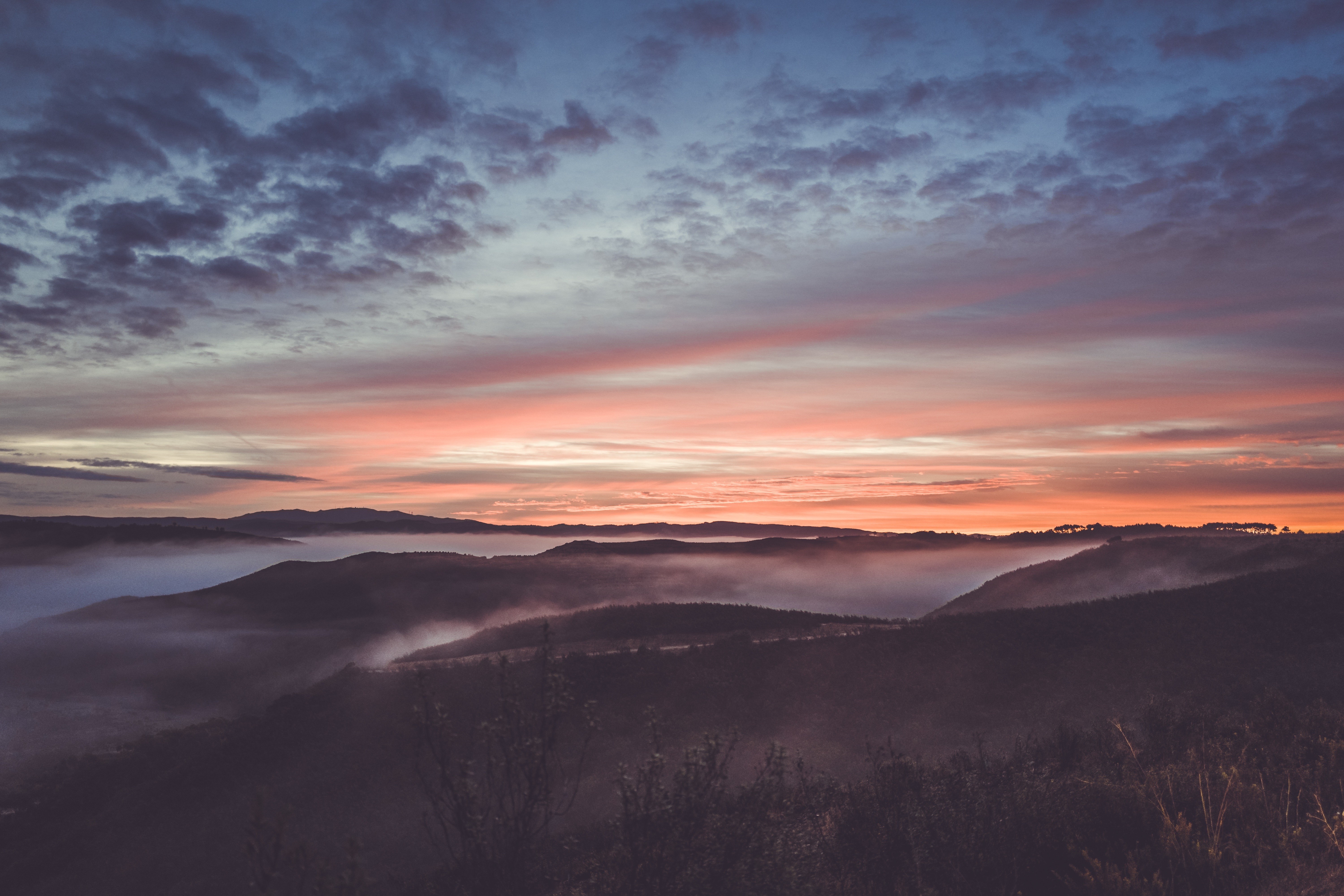 Misty mountains at sunrise with colorful sky HD Wallpaper