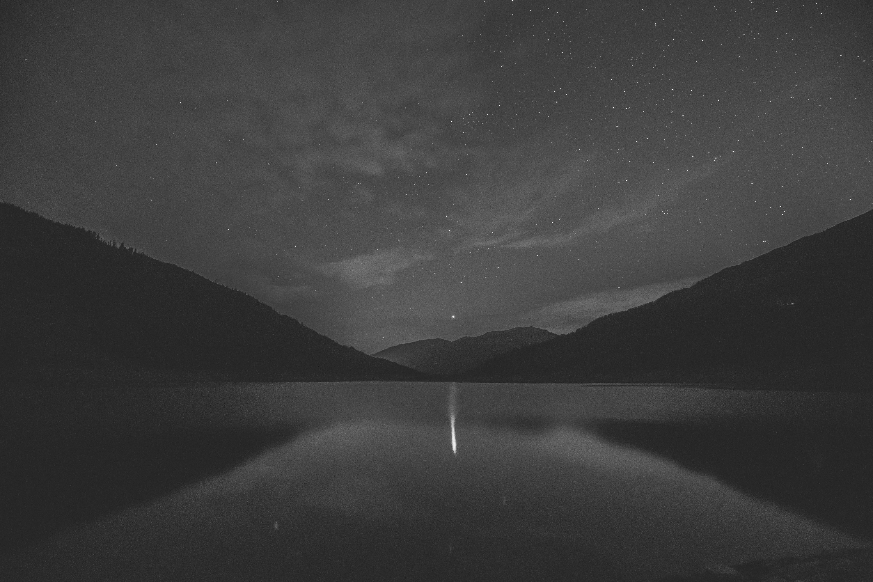 Monochrome lake under starry night sky HD Wallpaper