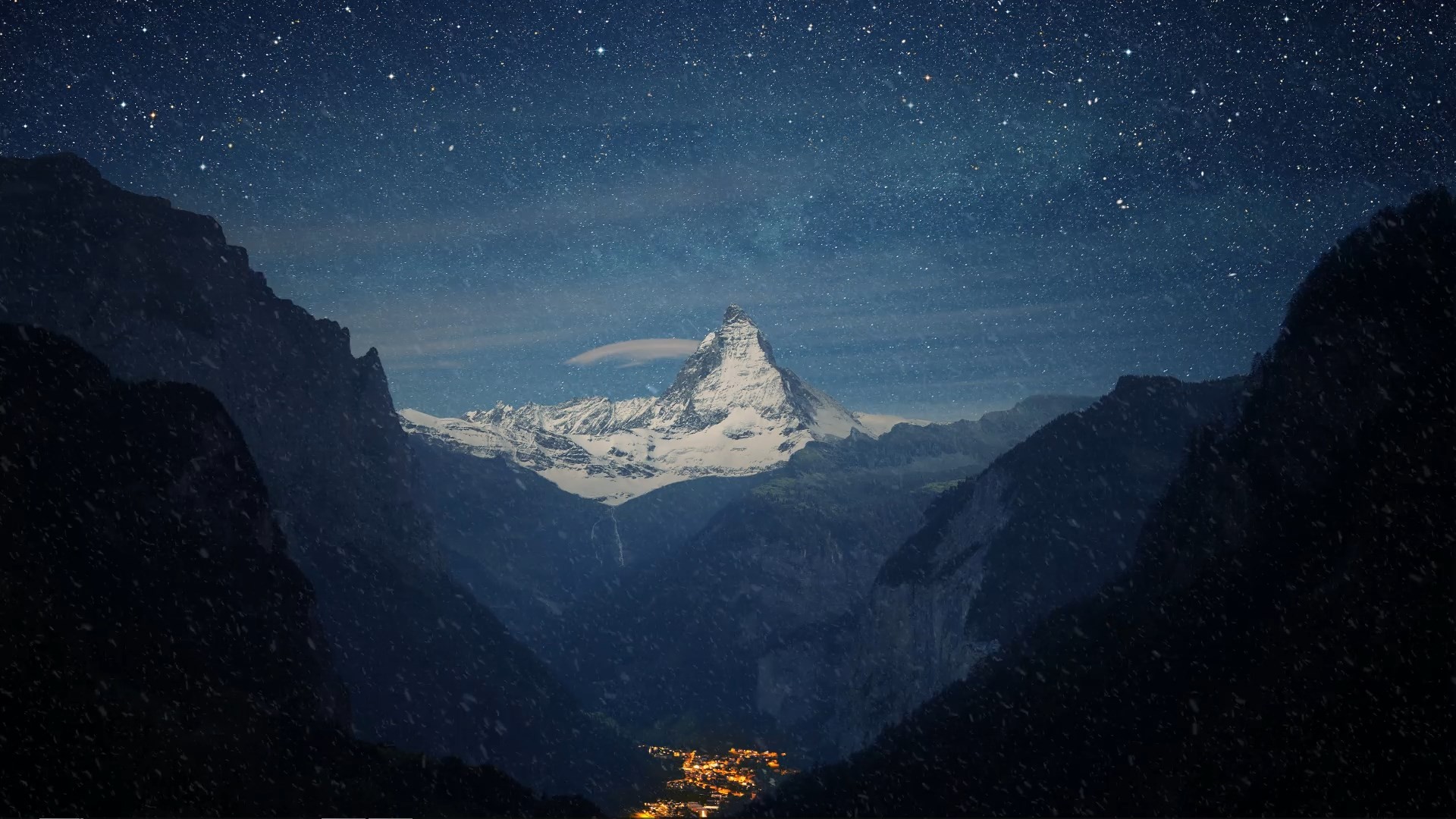 Snow-capped Matterhorn mountain under a starry night sky HD Wallpaper