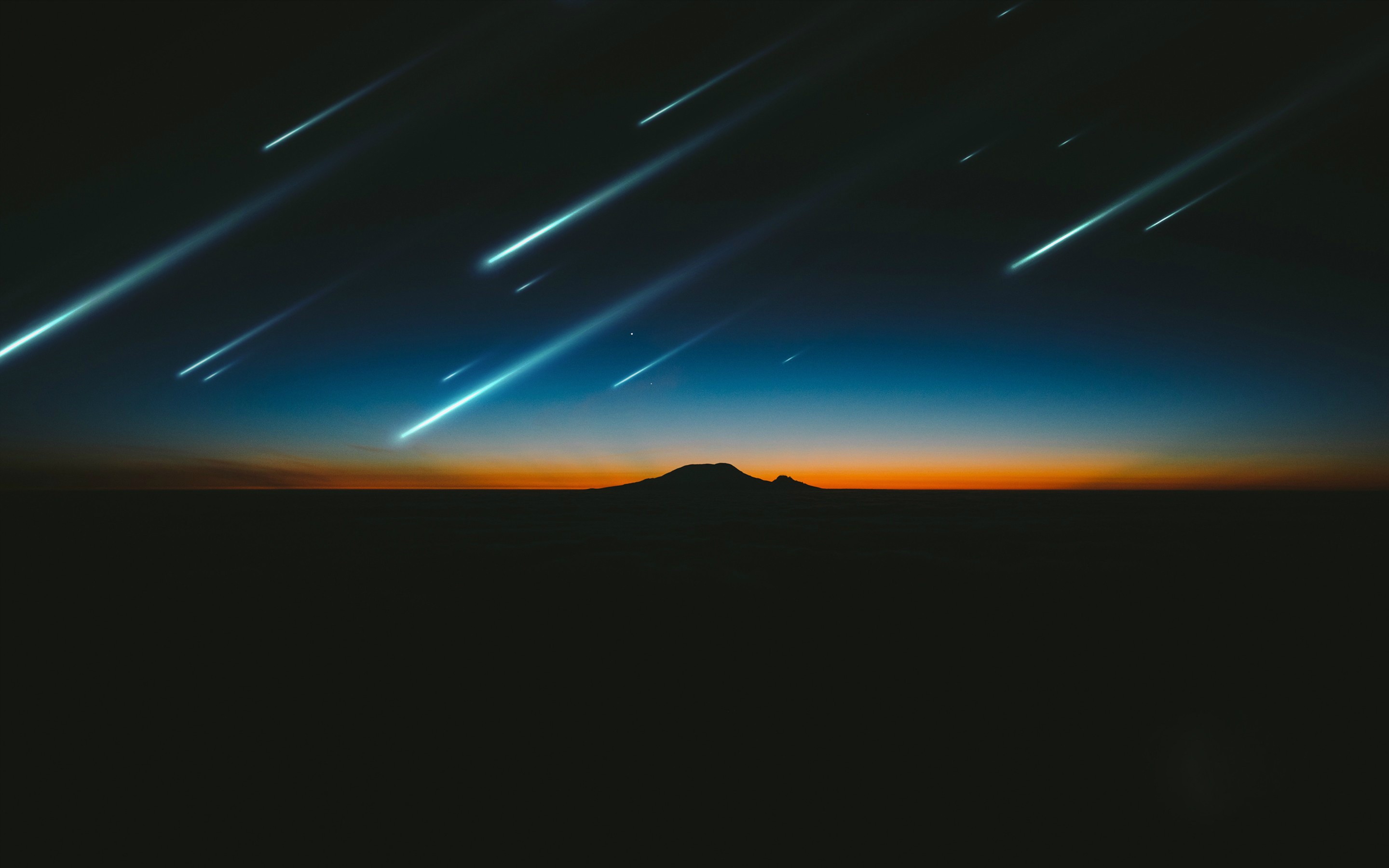 Meteor shower over a mountain at dusk HD Wallpaper