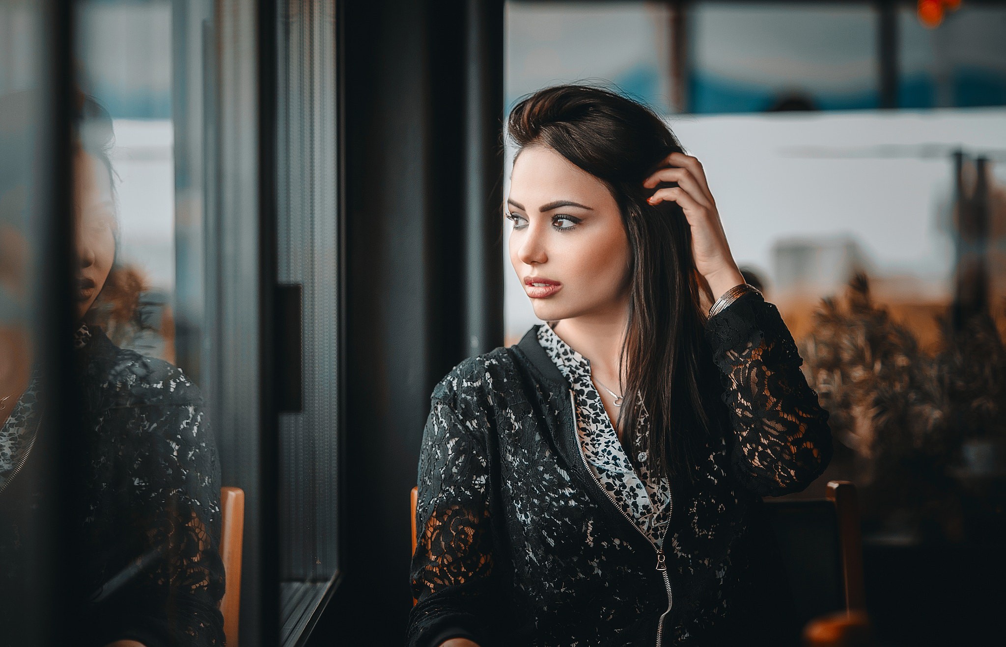 Woman in black lace jacket looking away HD Wallpaper