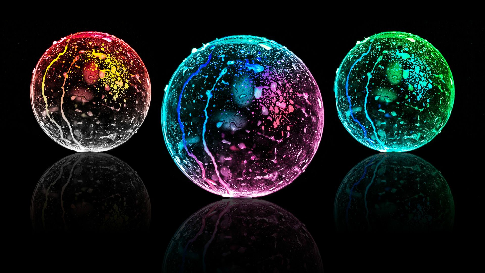 Three colorful glowing spheres with reflections HD Wallpaper
