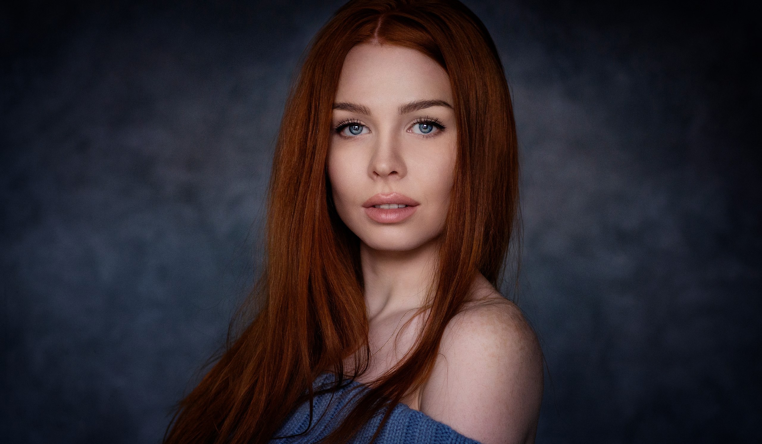 Redhead woman with blue eyes in a blue sweater HD Wallpaper