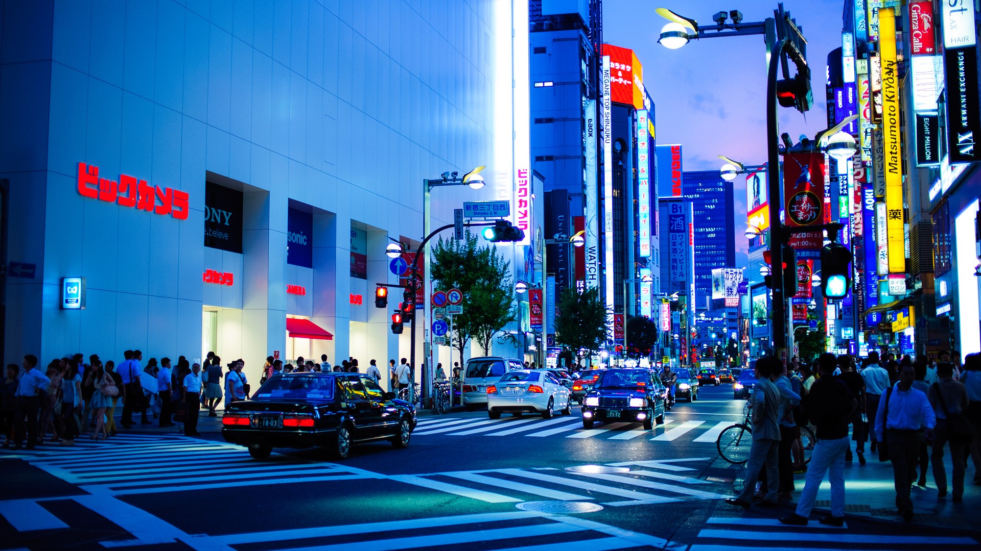 Shinjuku, Tokyo street at night with neon signs HD Wallpaper