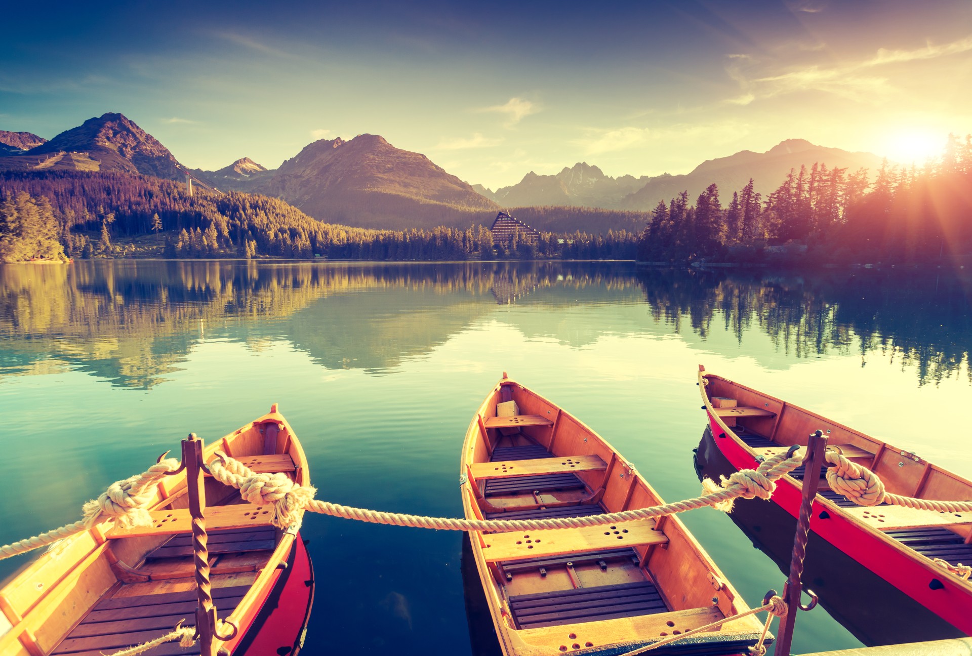 Boats on a lake with mountains and forest HD Wallpaper