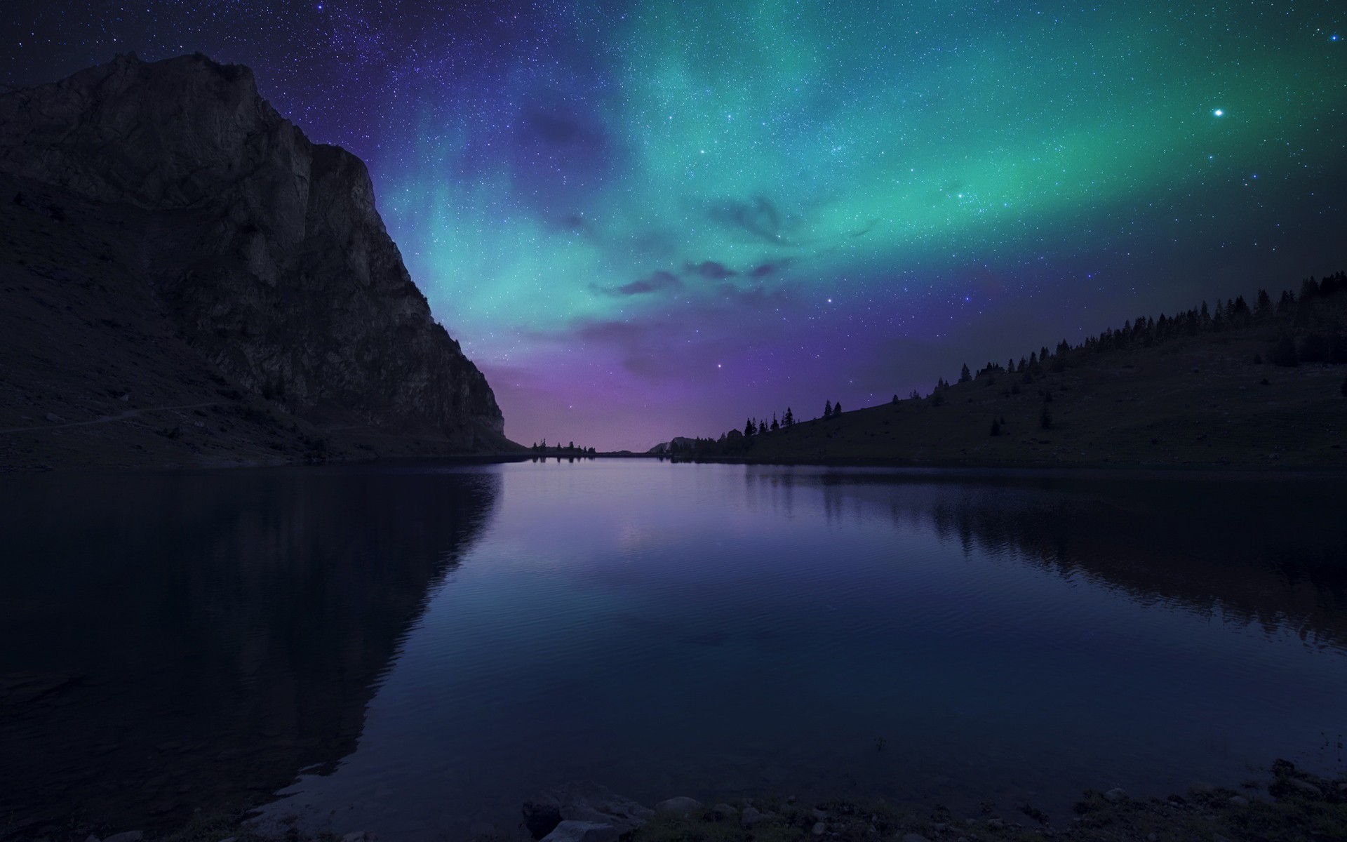 Aurora Borealis over a mountain lake HD Wallpaper