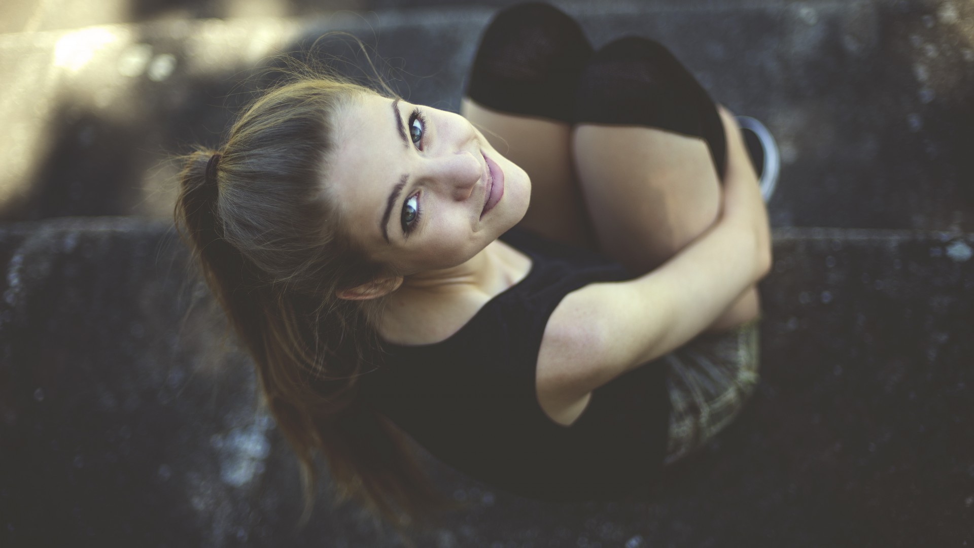 Woman with ponytail sitting on steps HD Wallpaper