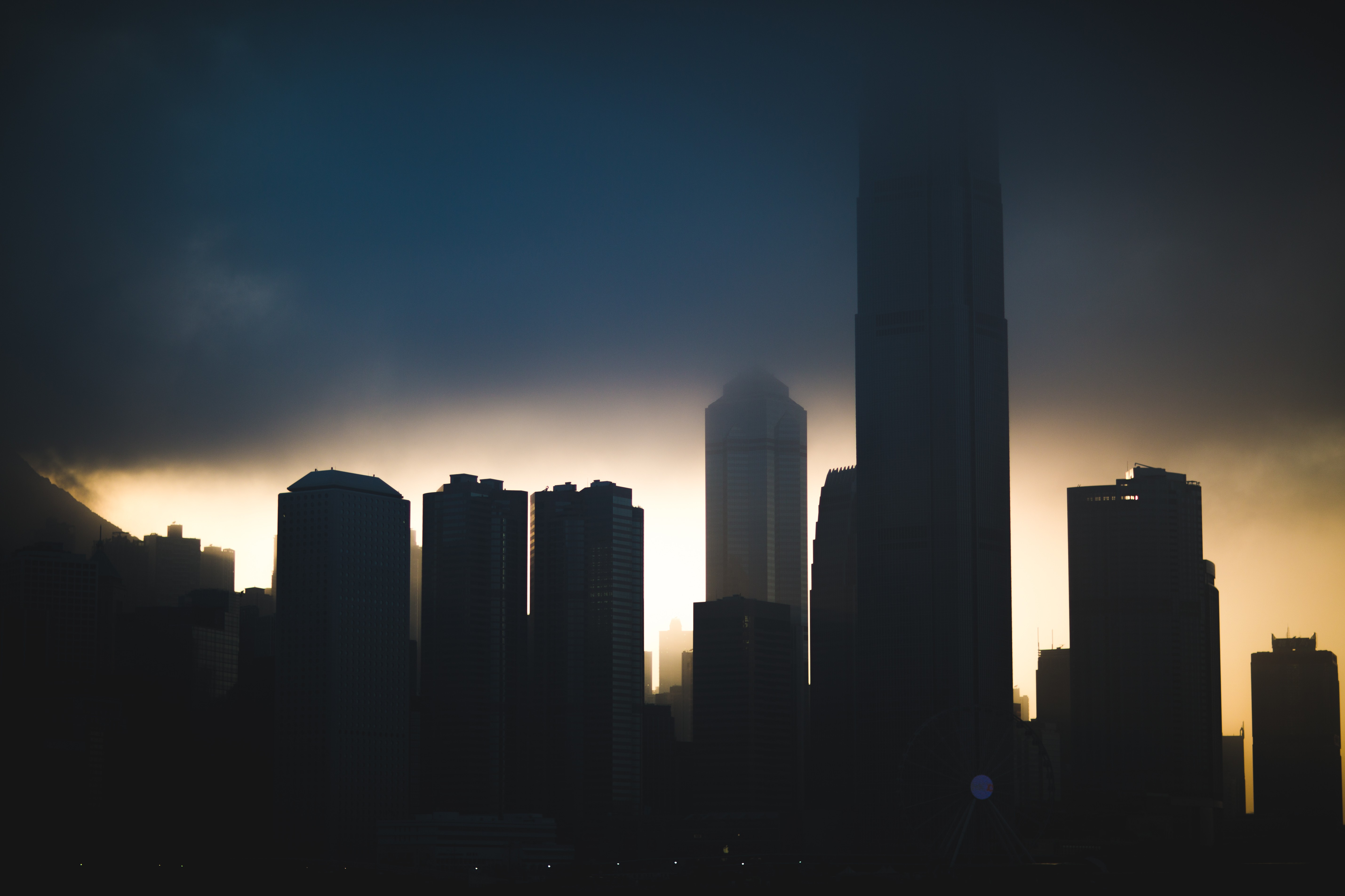 Hong Kong skyline at sunset with clouds HD Wallpaper
