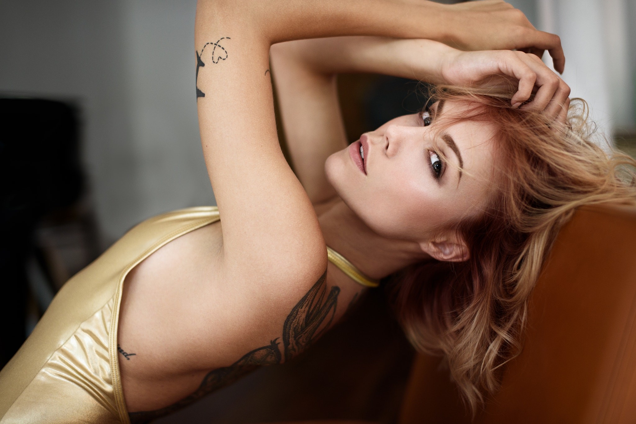 Woman with tattoos looking at viewer HD Wallpaper