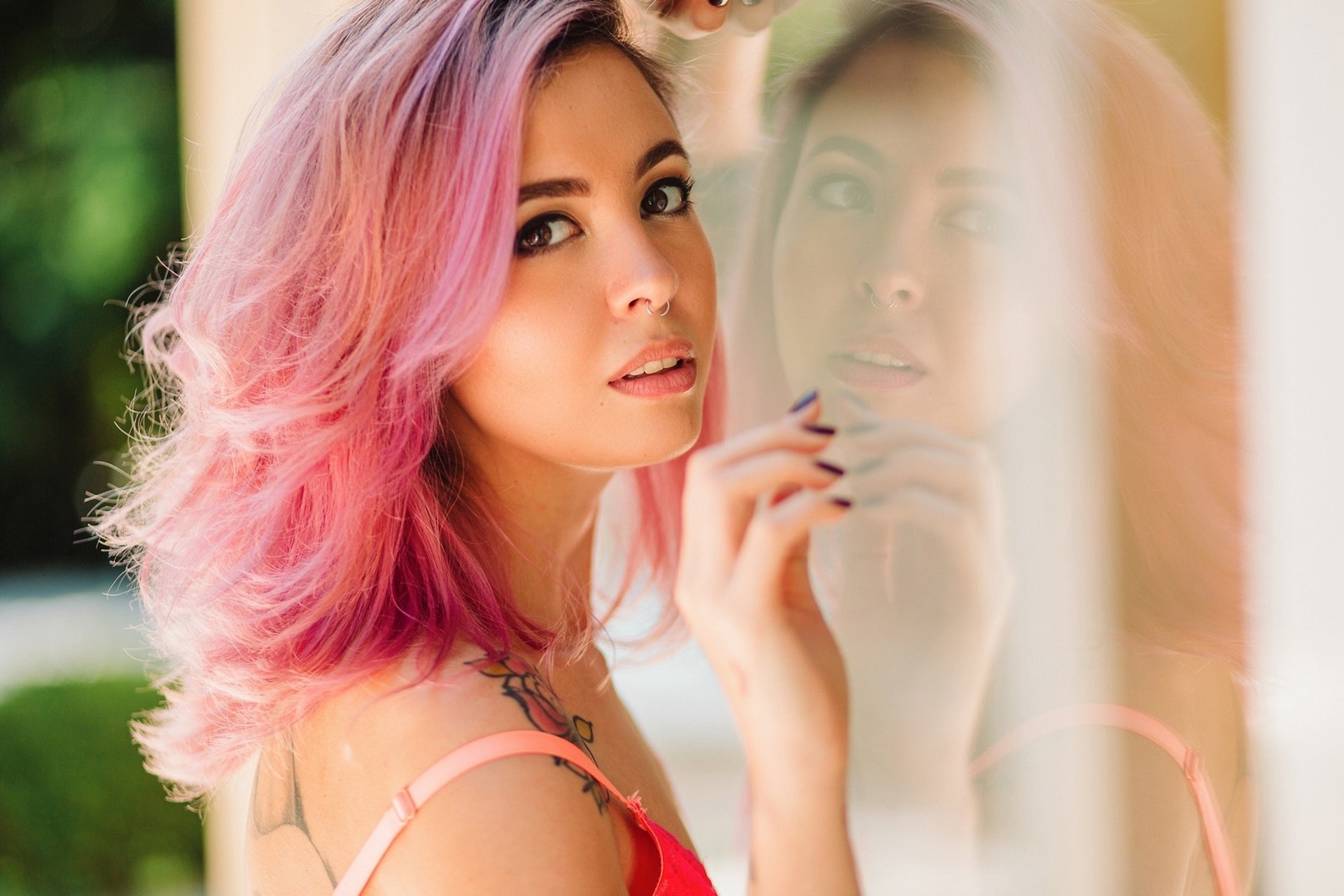 Woman with pink hair and tattoos reflected in glass HD Wallpaper