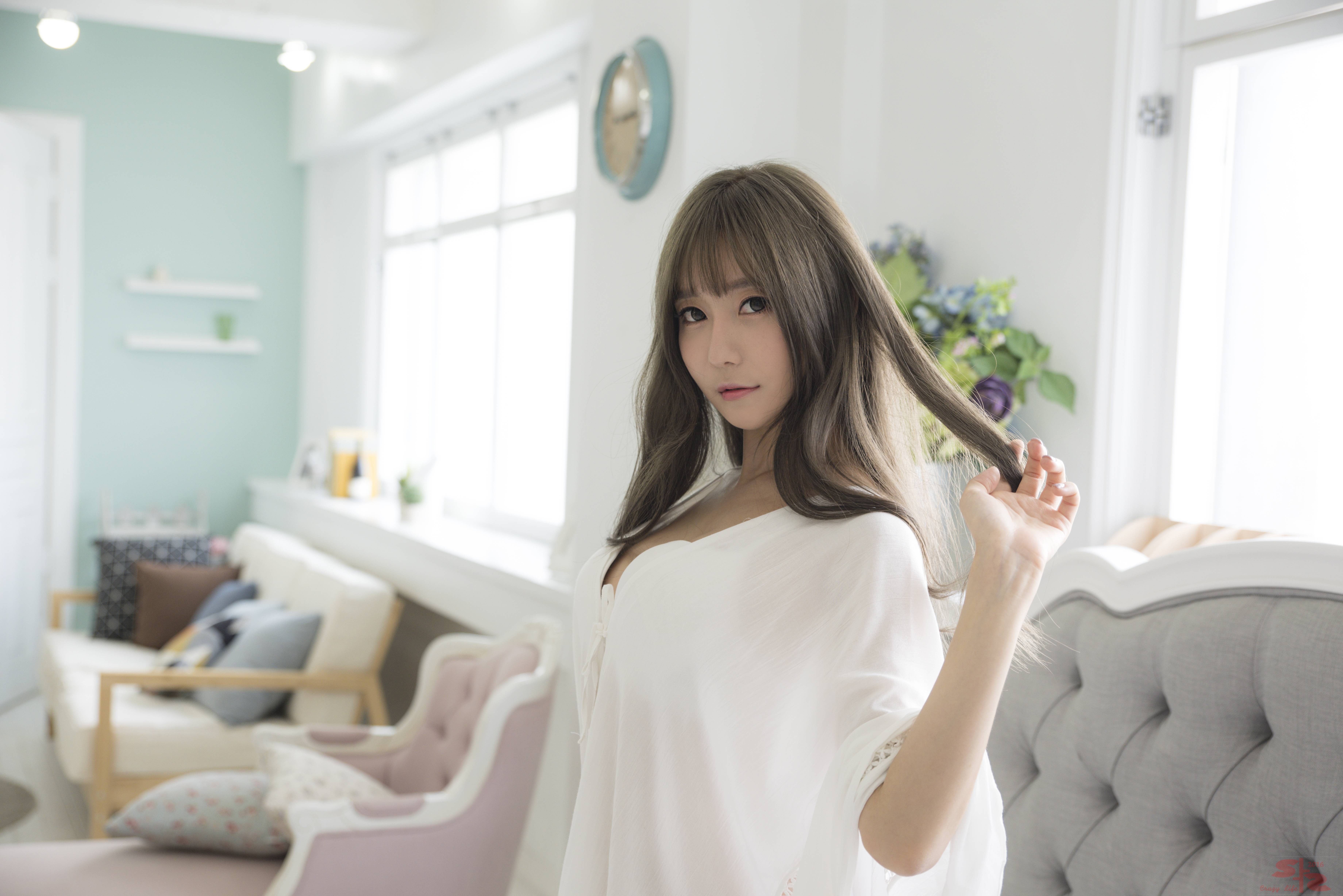 Asian woman with long brown hair in white clothing indoors HD Wallpaper