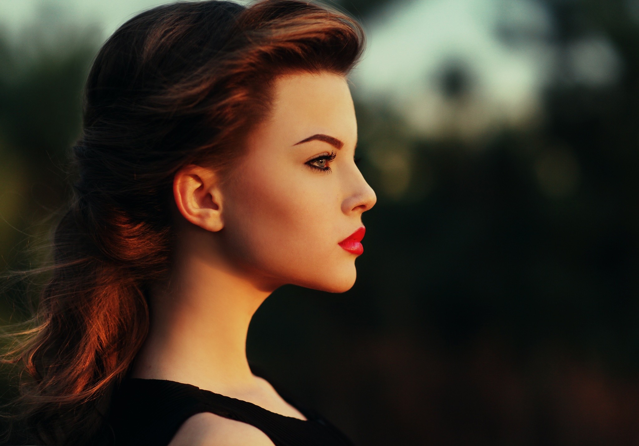 Woman in profile with red lipstick and styled hair HD Wallpaper