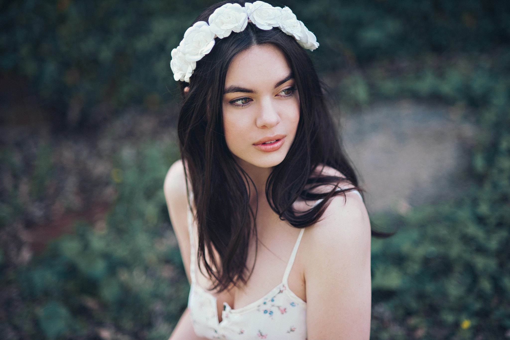 Woman with flower crown looking away HD Wallpaper