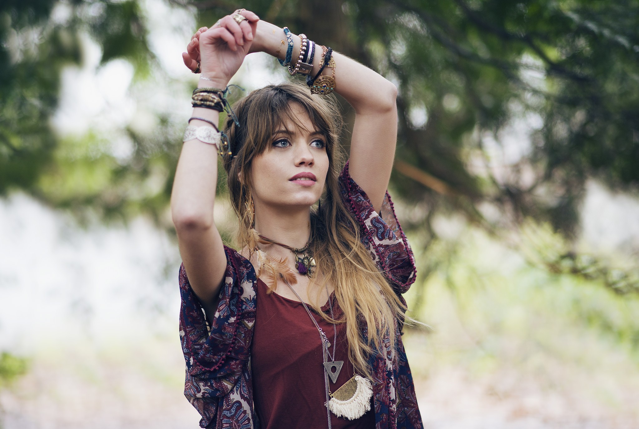Woman with arms up wearing jewelry outdoors HD Wallpaper