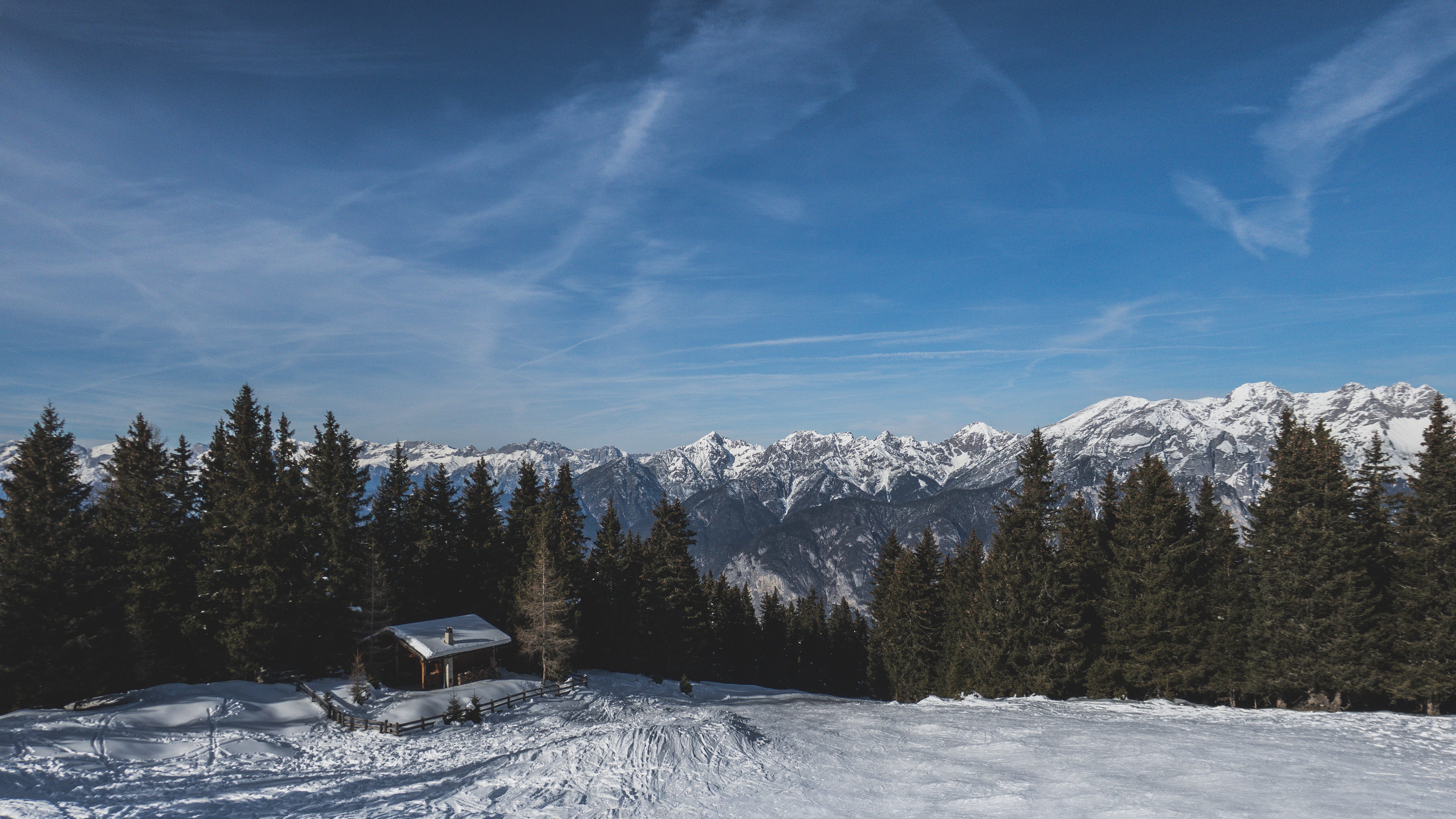 Winter mountain landscape with a small hut and pine trees HD Wallpaper