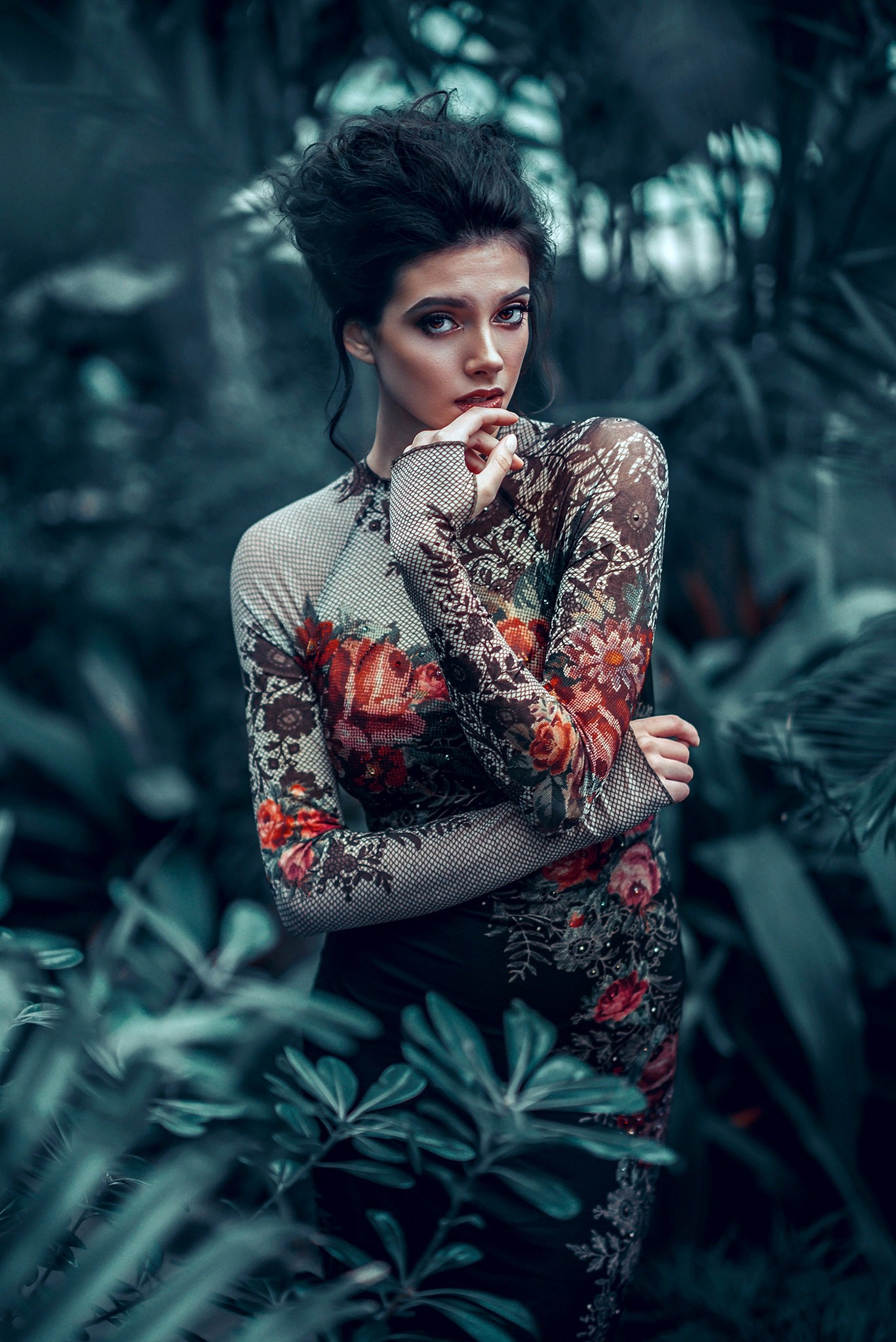 Woman in floral dress in a dark garden HD Wallpaper
