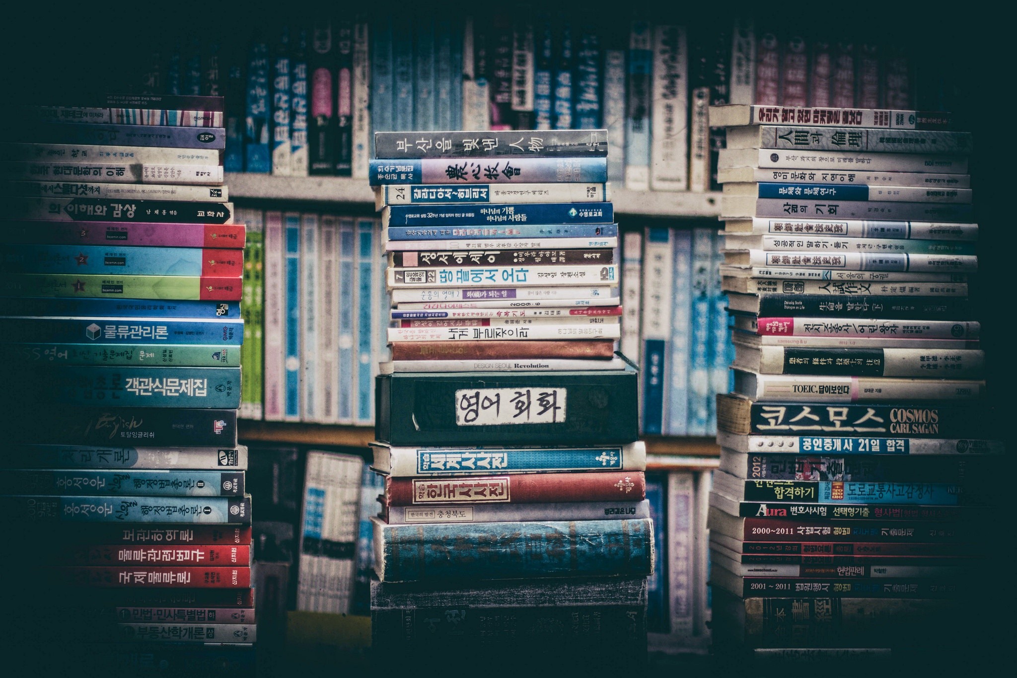 Stacks of Korean Books on Shelves HD Wallpaper