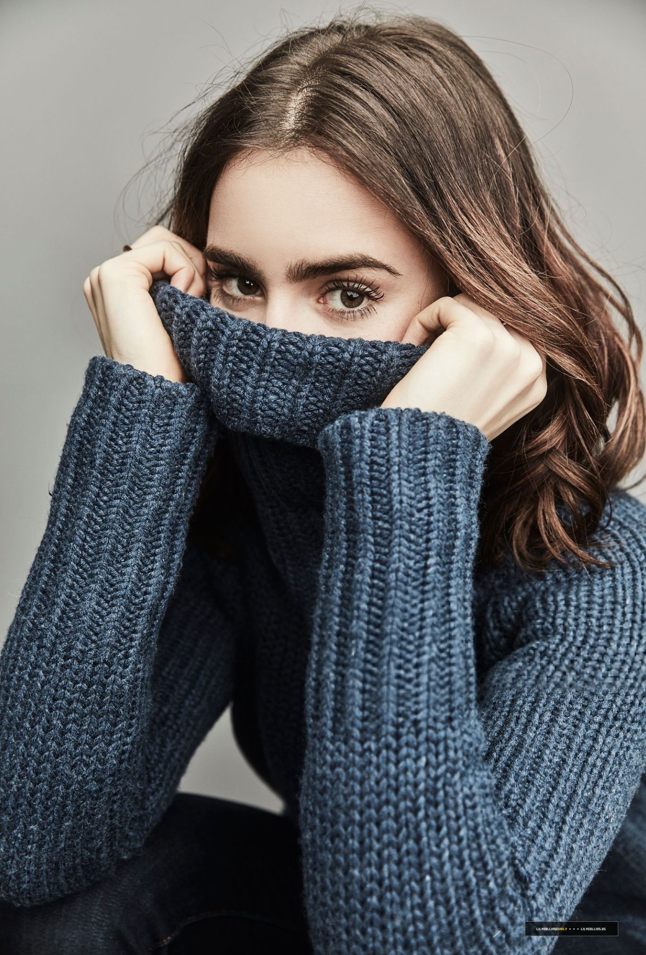 Lily Collins wearing a blue turtleneck sweater HD Wallpaper