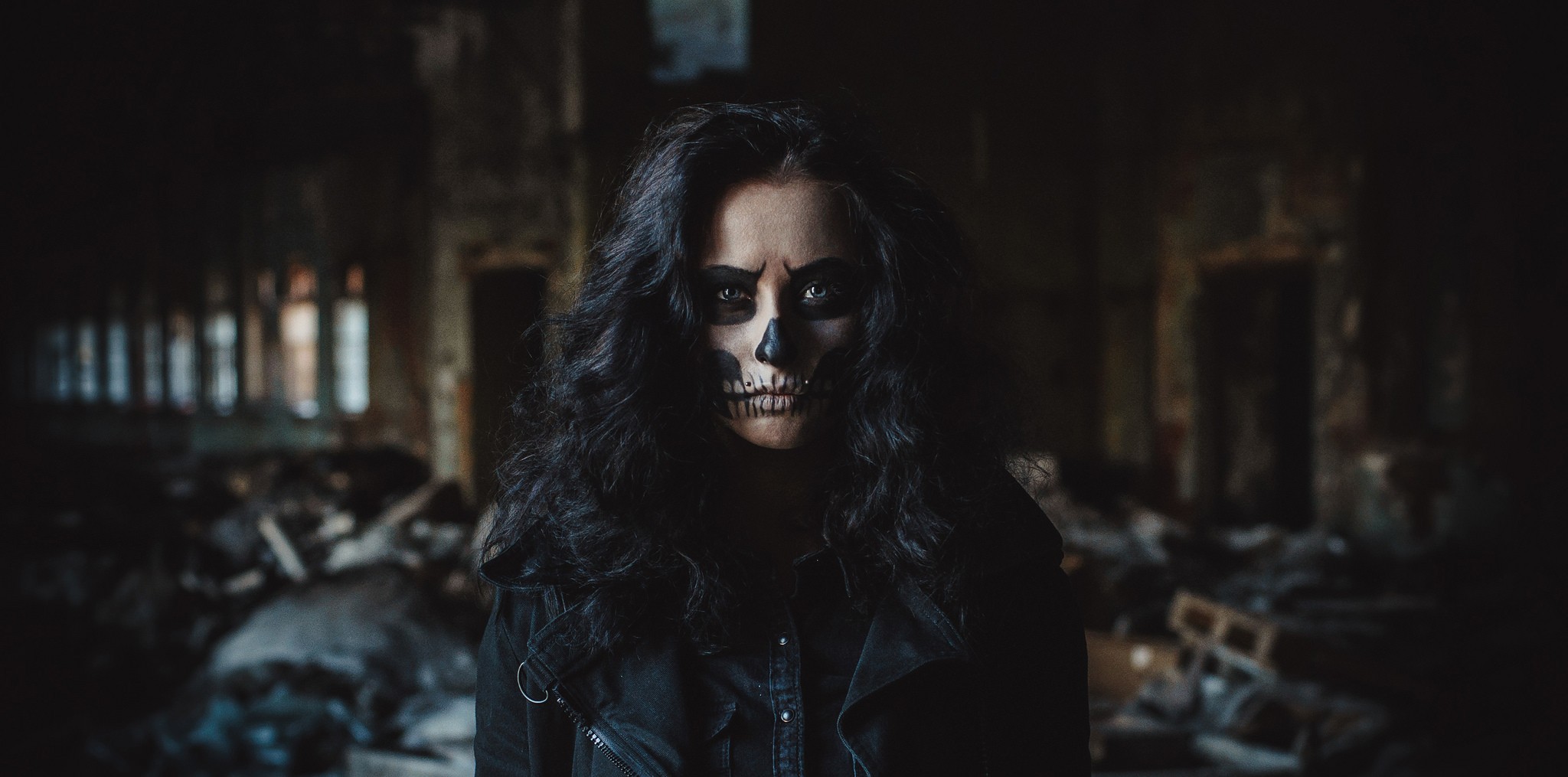 Woman with skull face paint in abandoned building HD Wallpaper