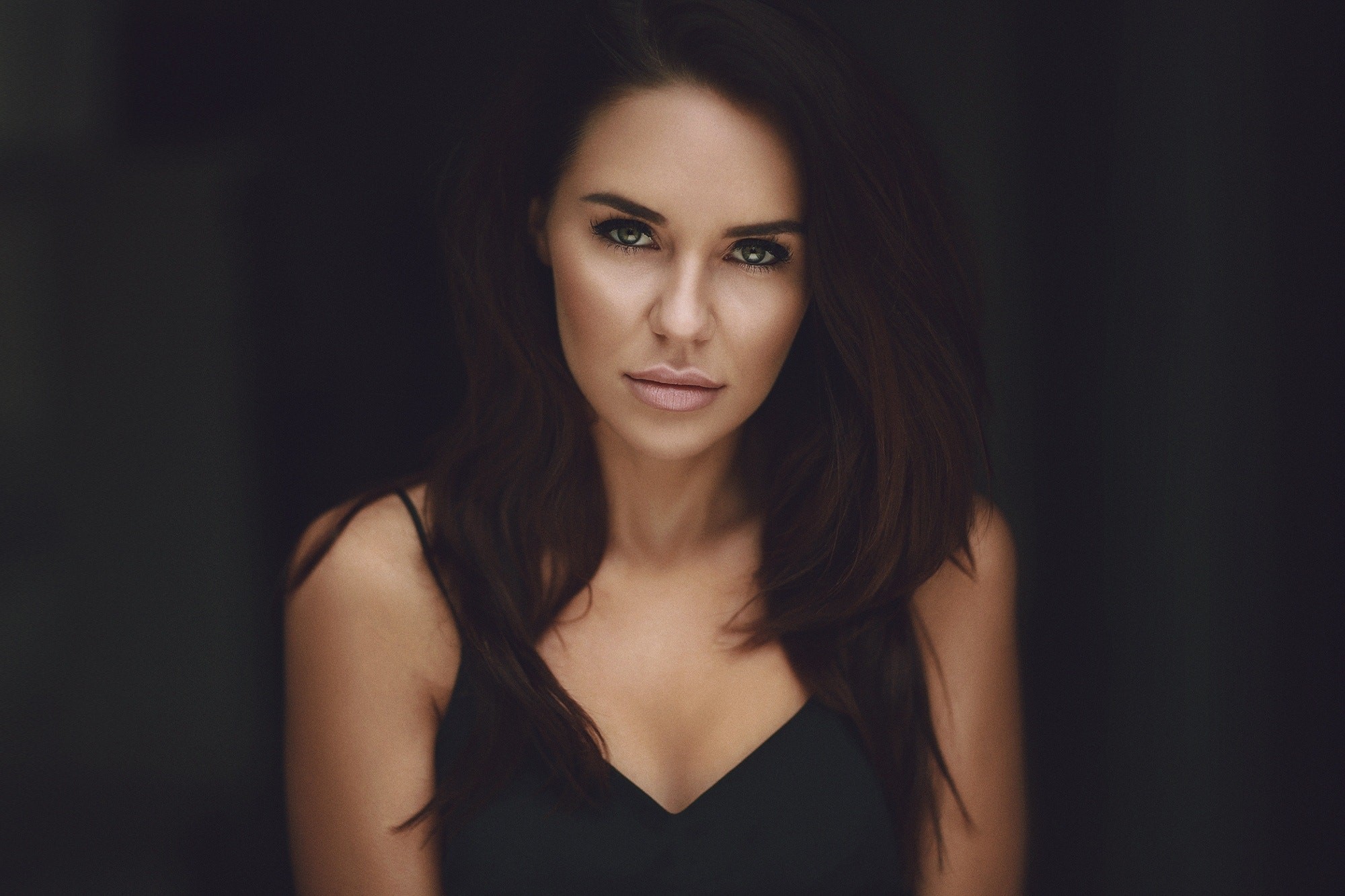 Woman with dark hair in a black top HD Wallpaper