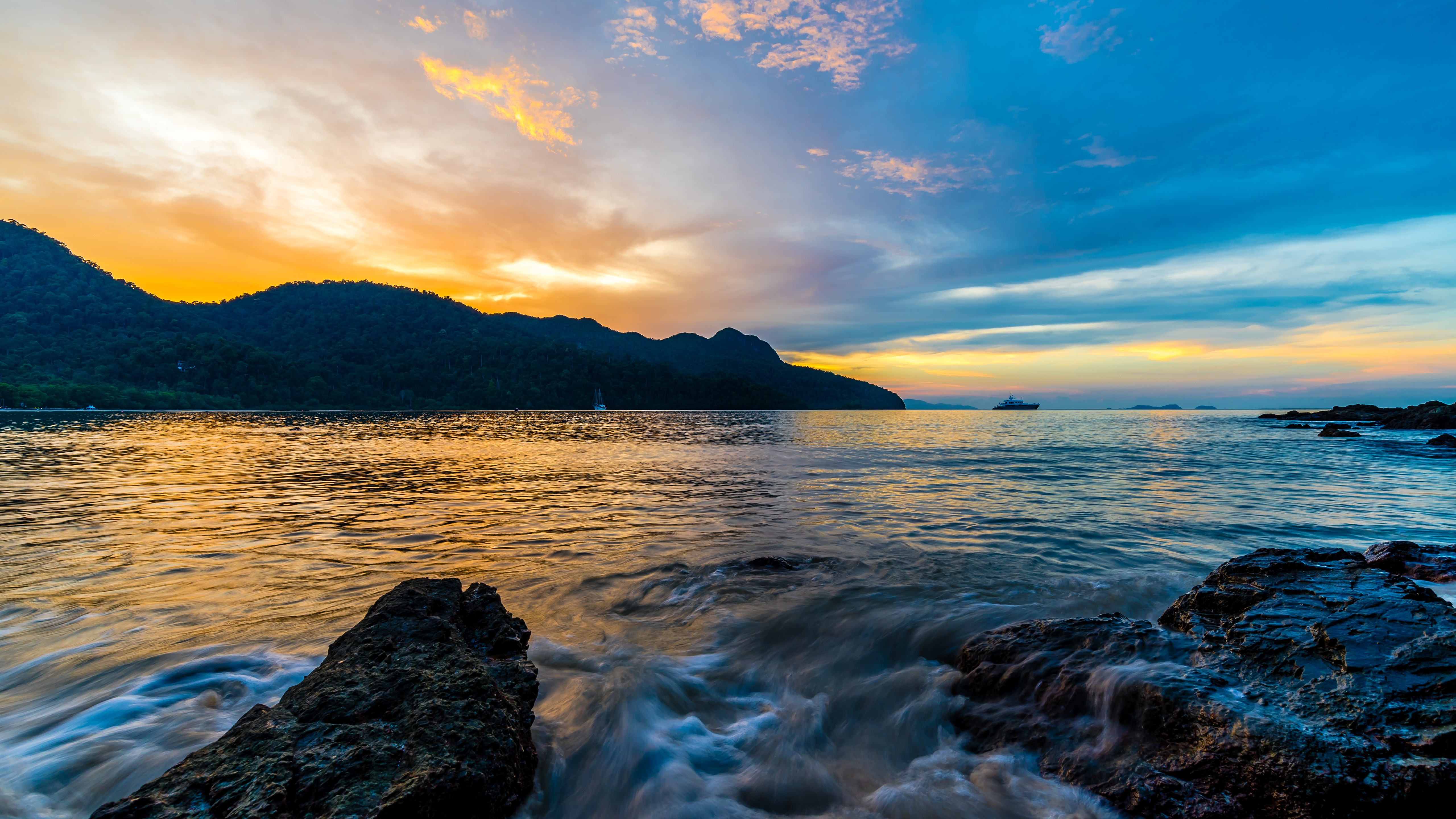 Sunset over Datai Bay with mountains and ocean HD Wallpaper