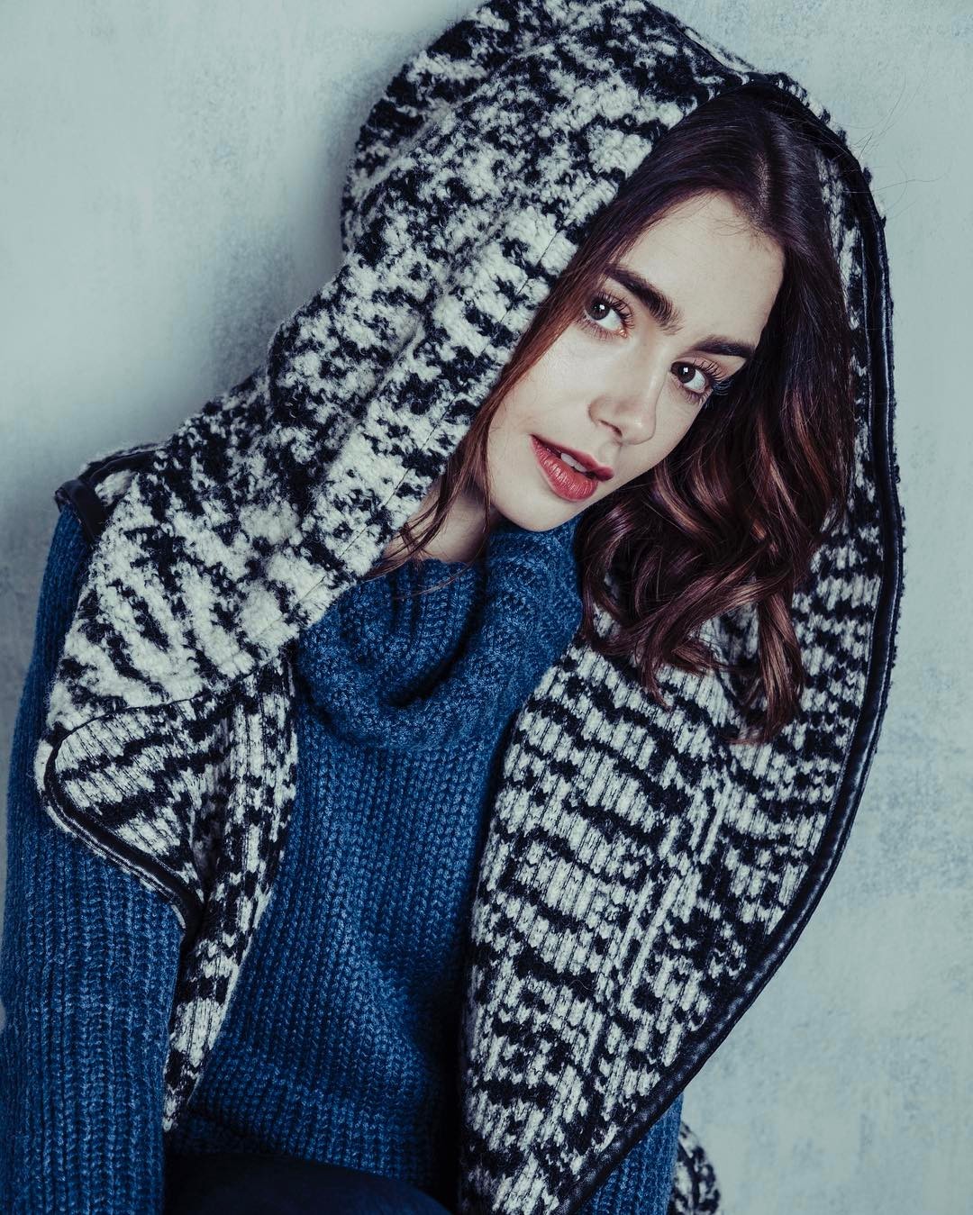Lily Collins wearing a blue sweater and patterned scarf HD Wallpaper